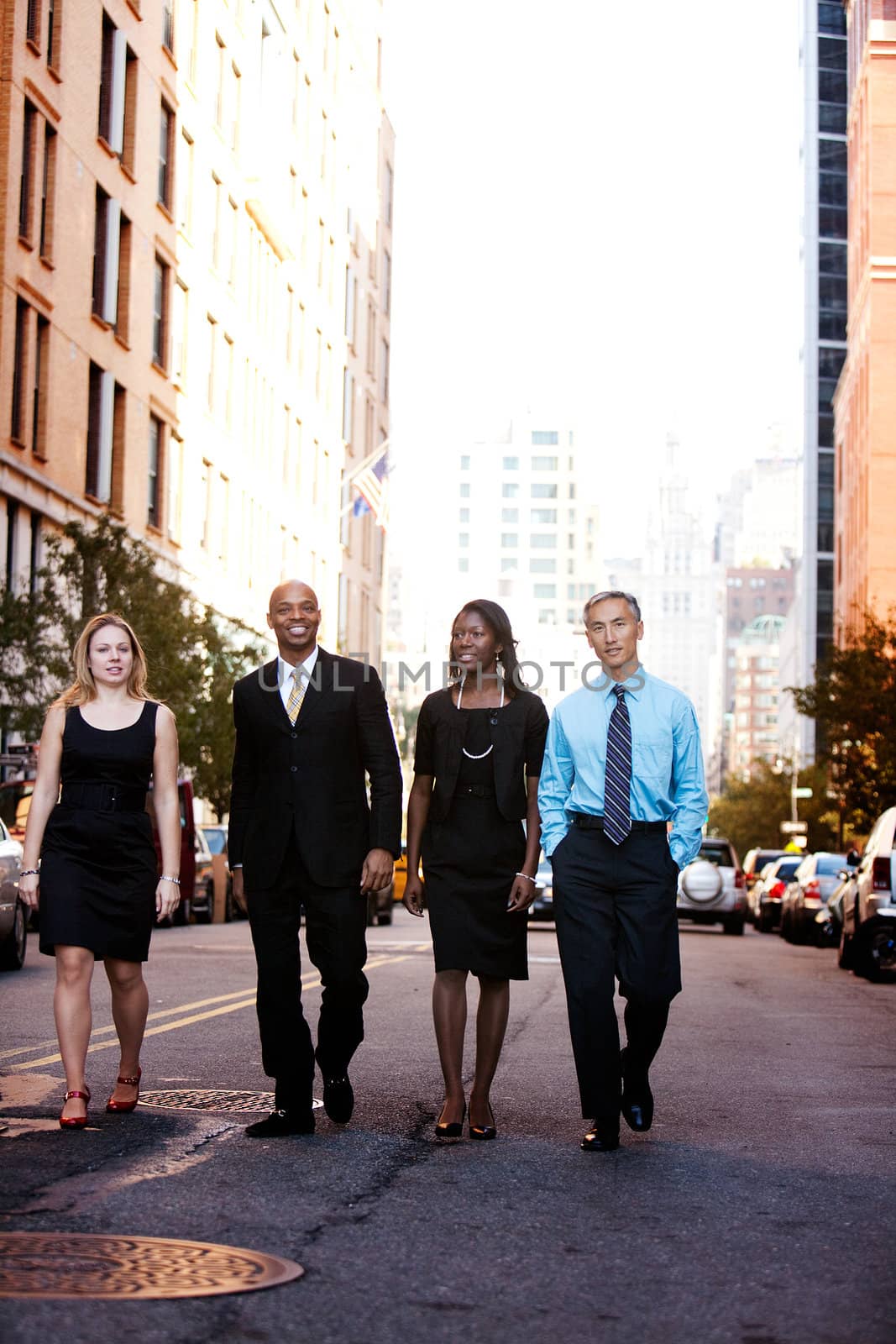 A business team outside on a street in a city