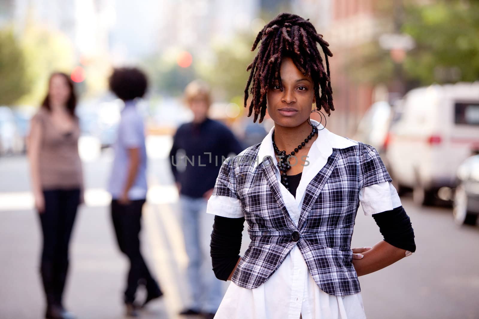 A beautiful african american woman in a city setting with friends