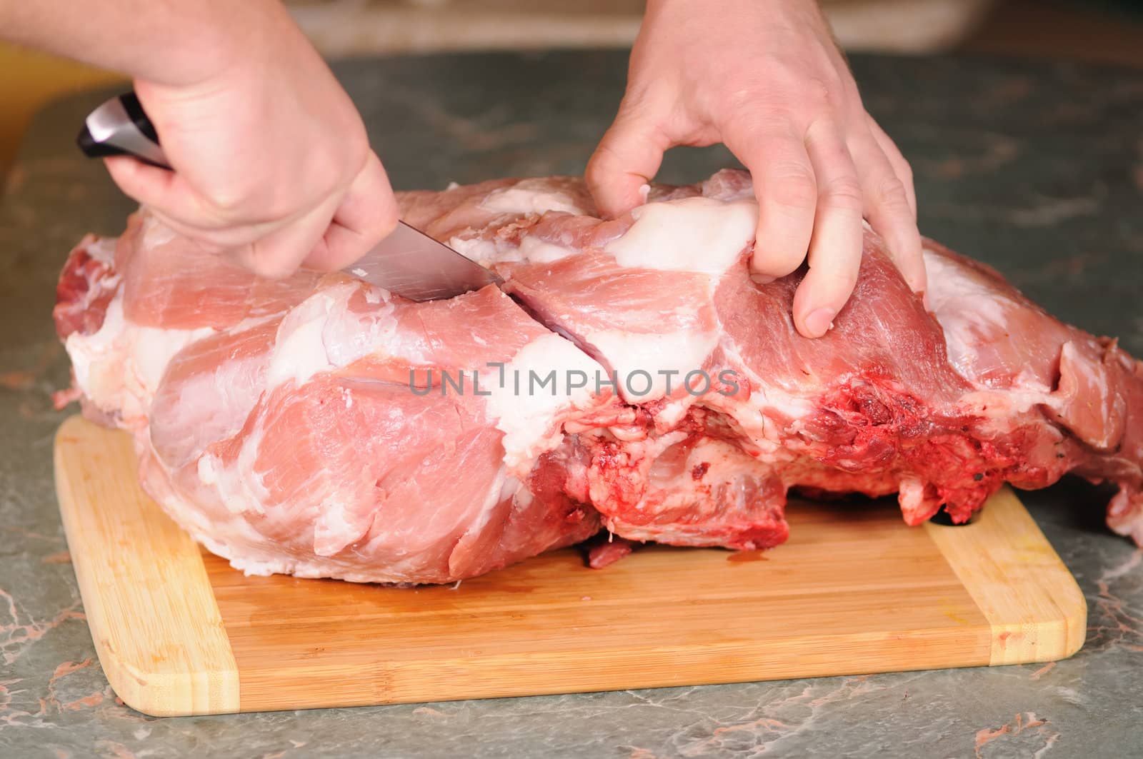 cutting of the big piece of meat