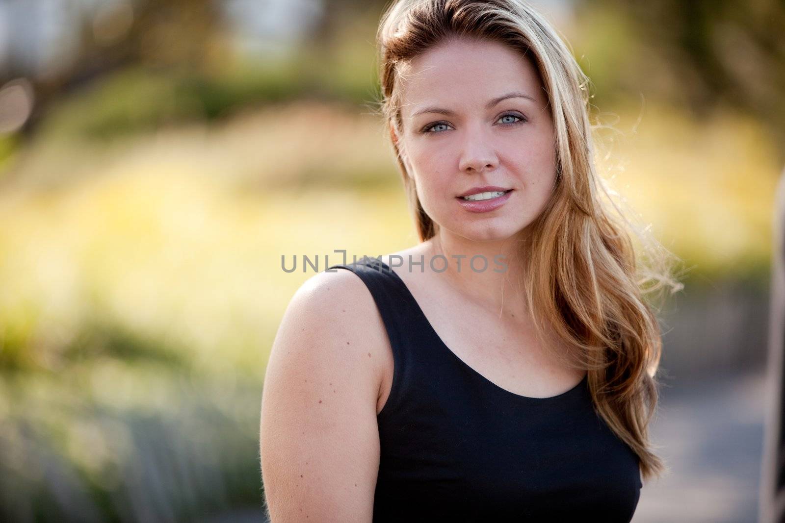 A beautiful caucasian business woman in an outdoor setting