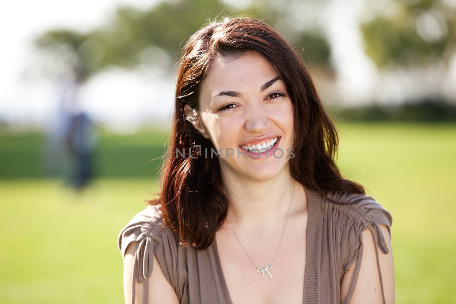 A young woman with friendly smile looking at the camera