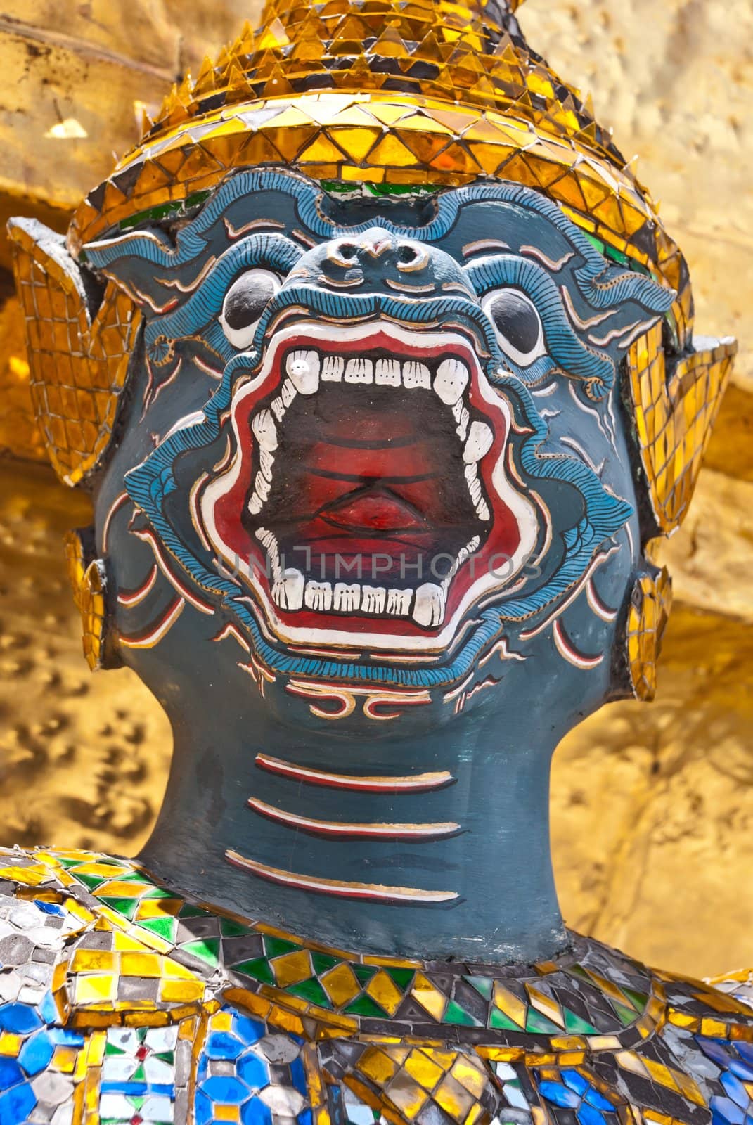 Guard at the entrance of temple in Wat Phra Kaeo Grand Palace in Bangkok, Thailand.
