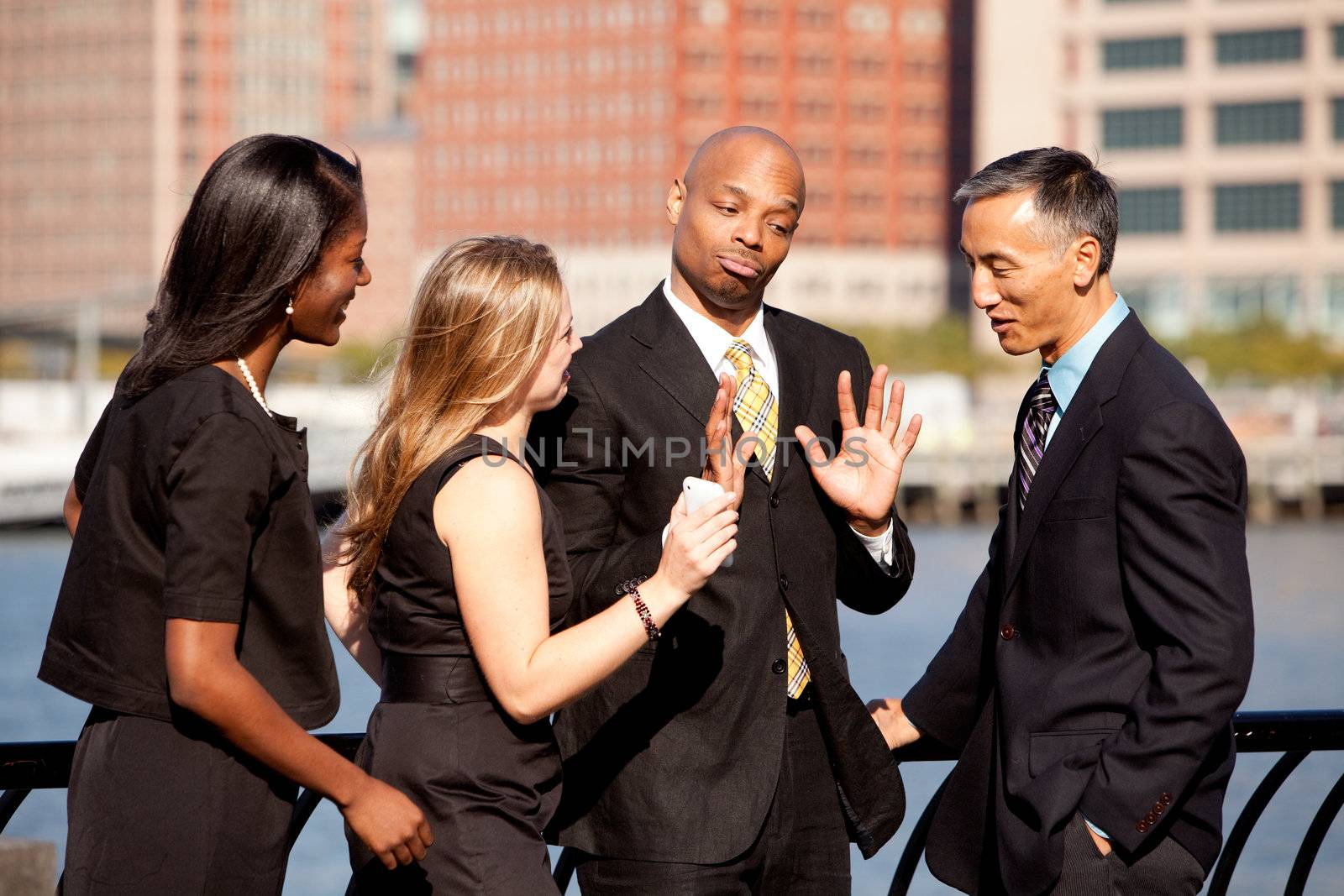 A group of business people outdoors in a discussion