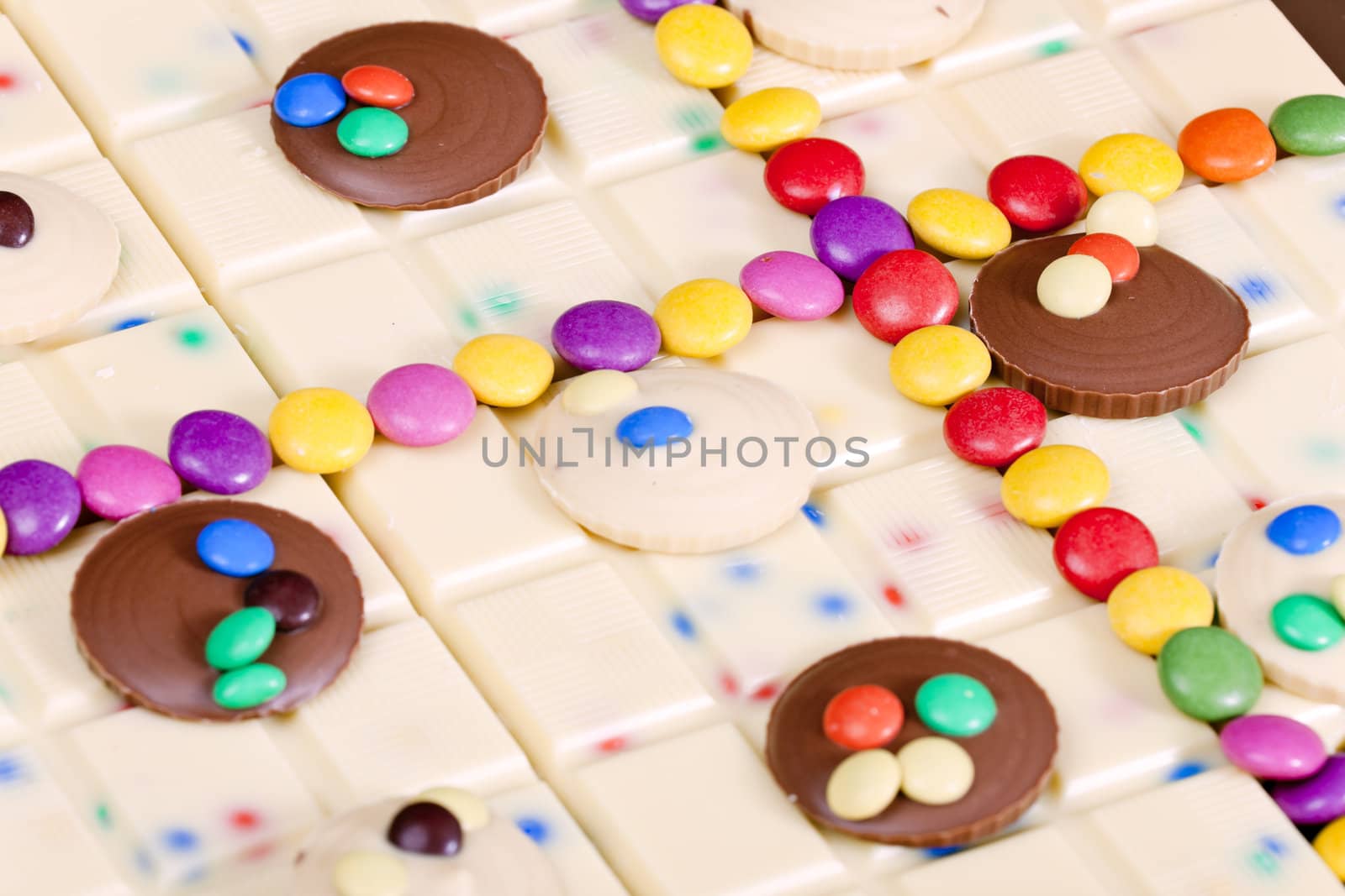 still life of white chocolate with smarties