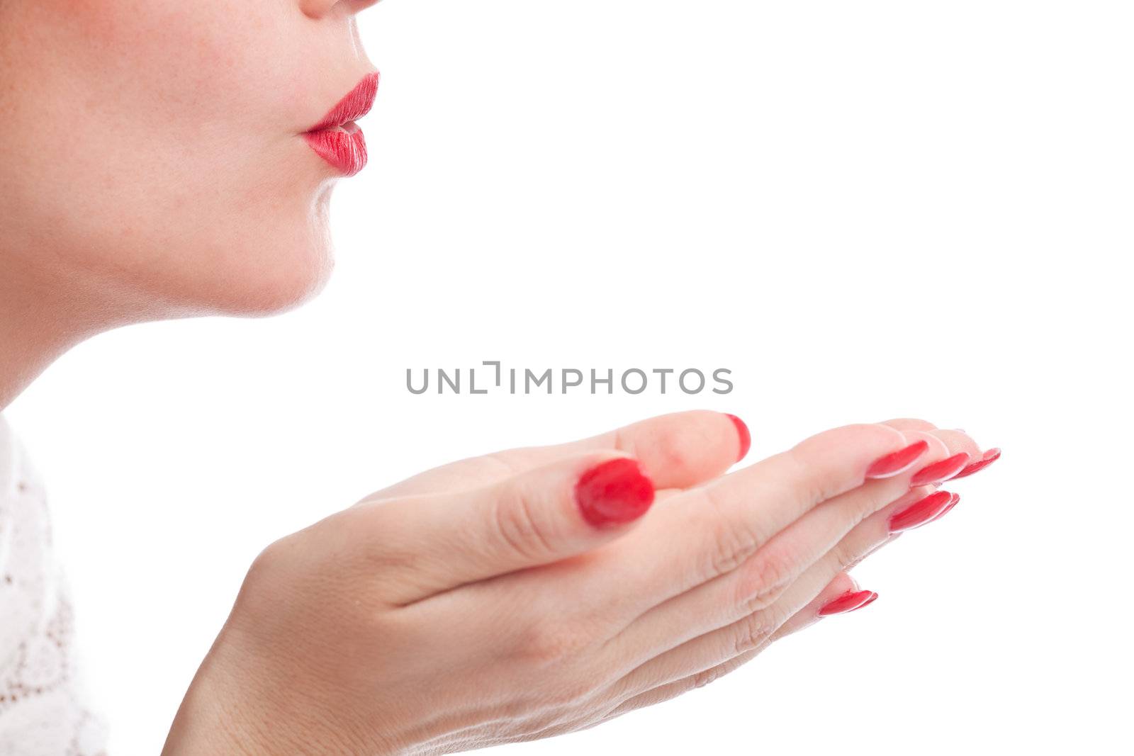 Female mouth blowing a kiss on white background