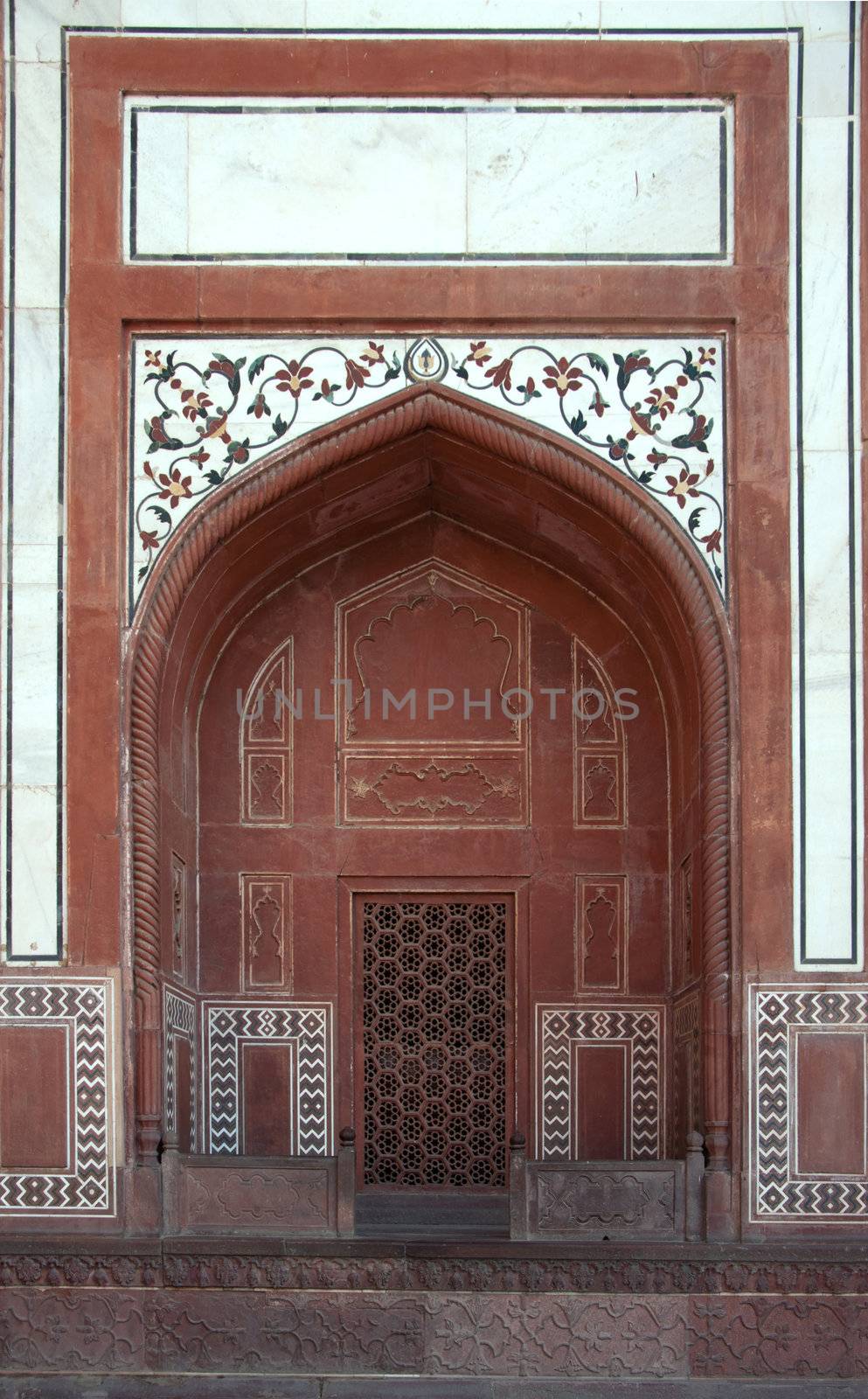 Focus on arch and decorations at gate to Taj Mahal complex in In by Claudine