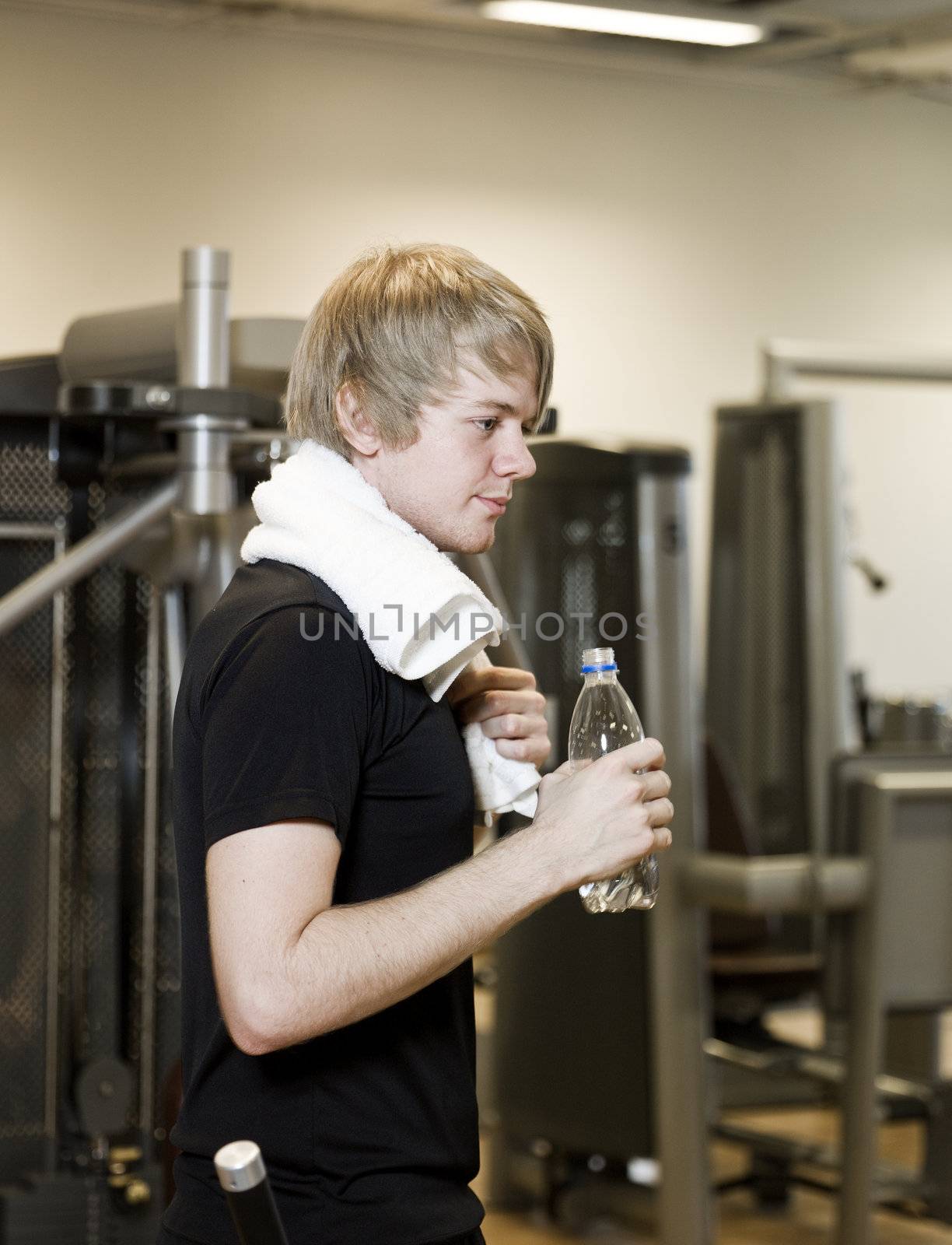 Young man taking a break at a health club