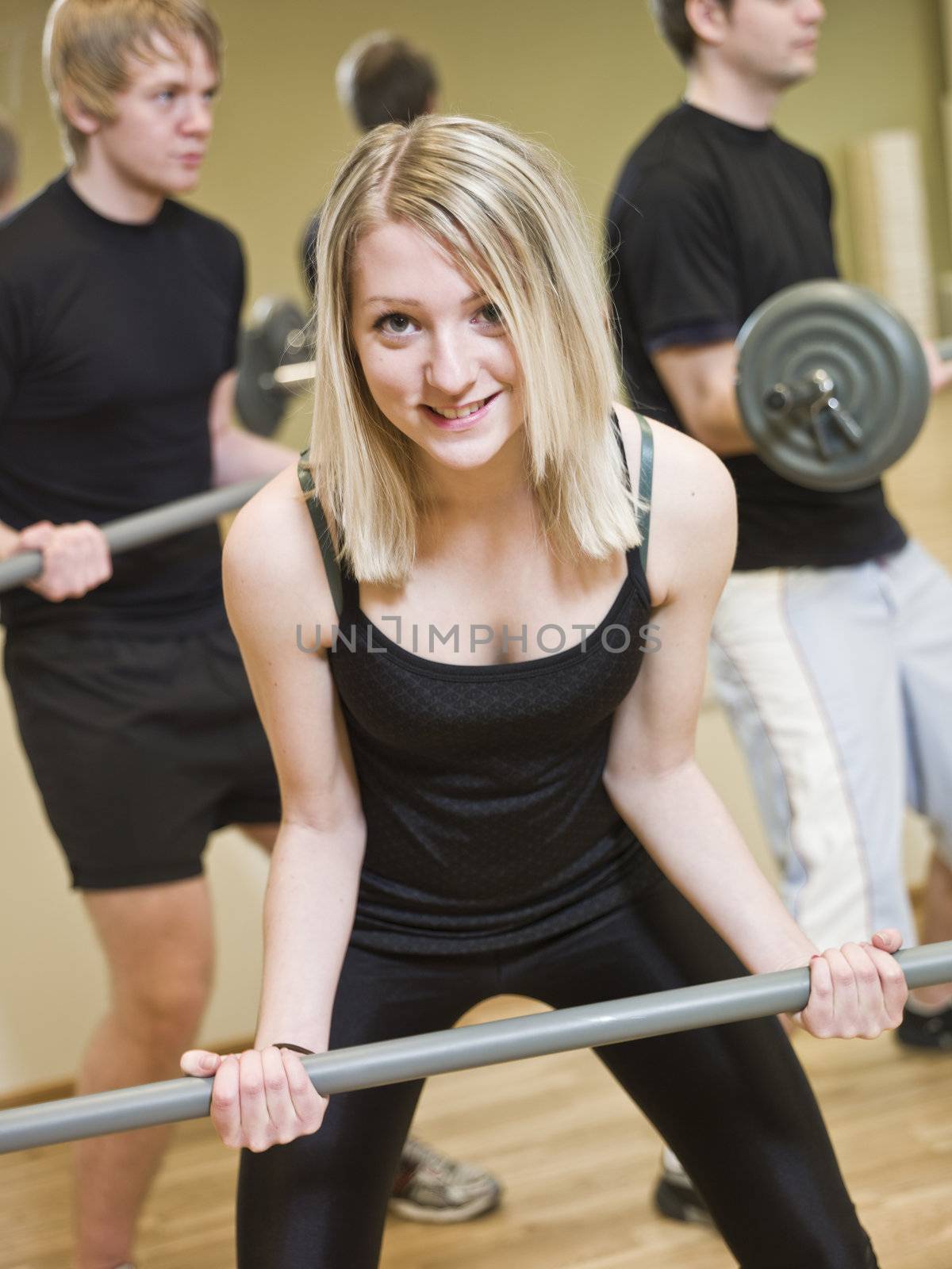 Girl lifting weights at the gym