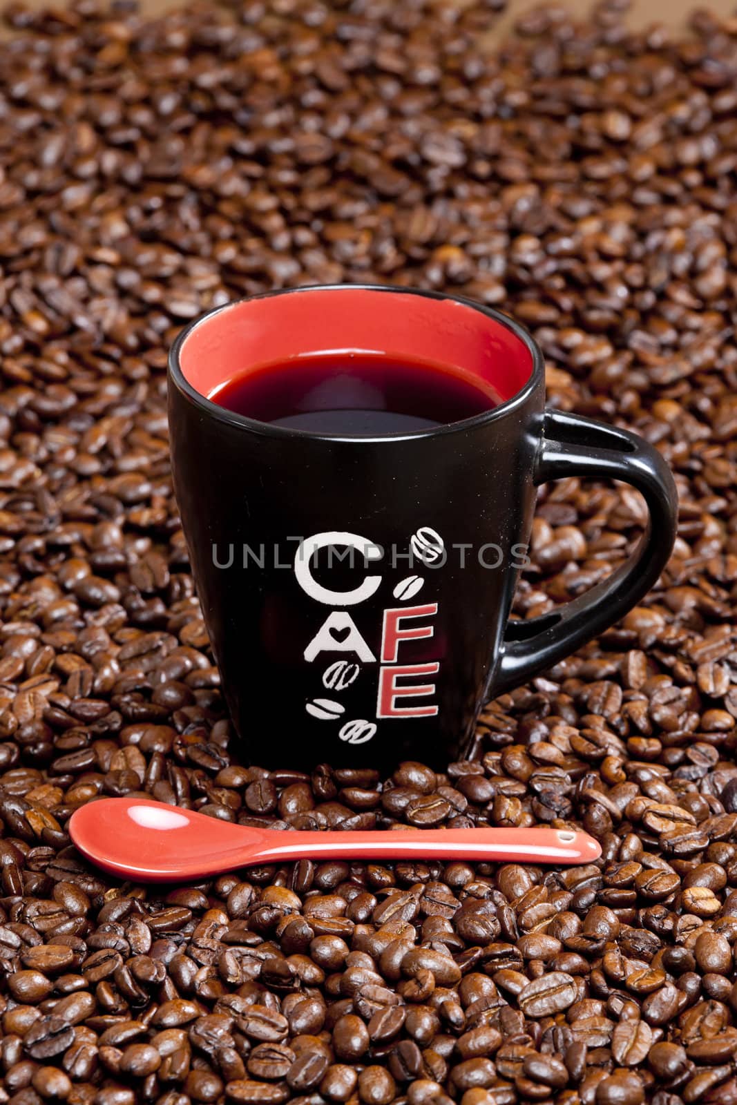 cup of coffee with coffee beans