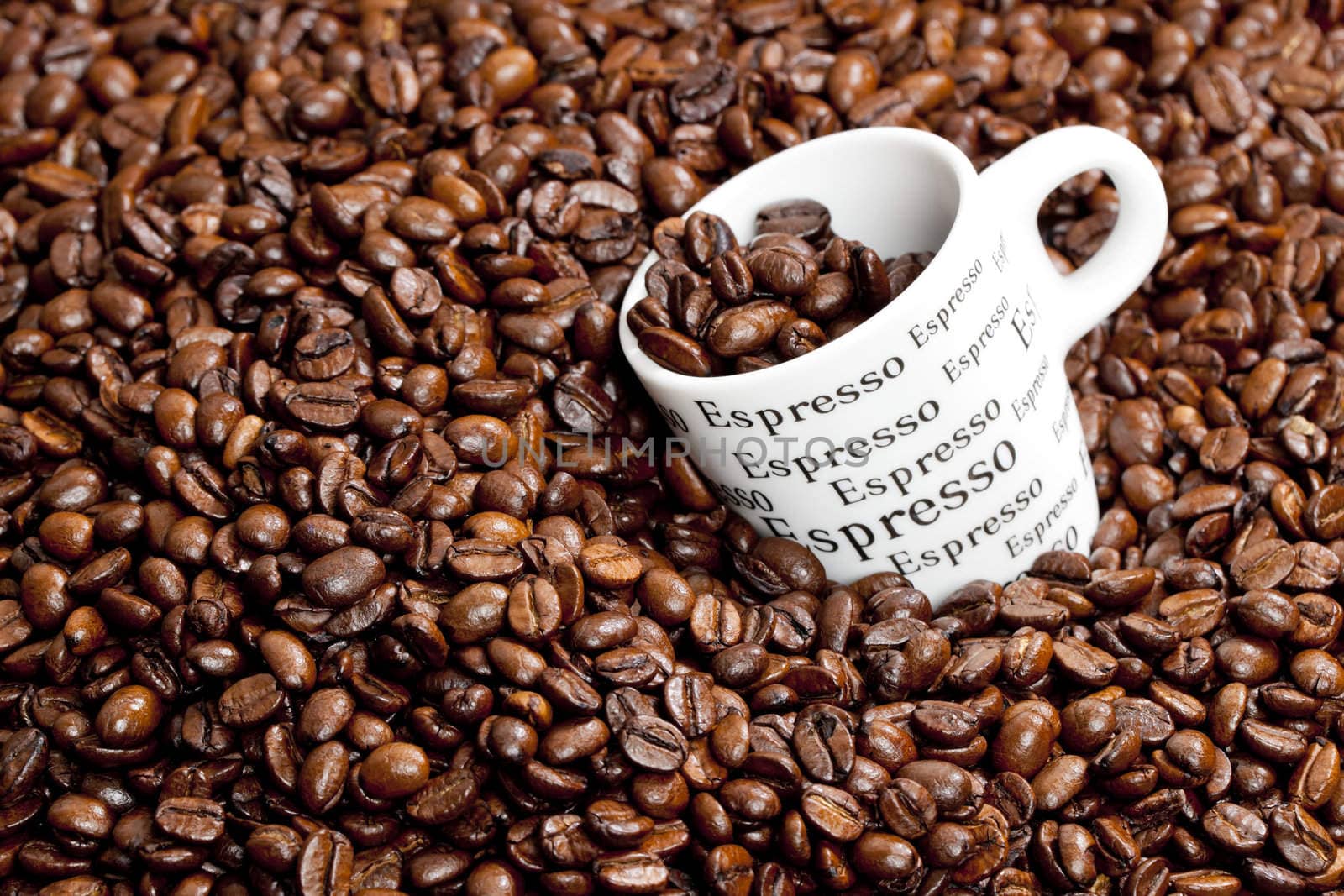 cup of coffee with coffee beans