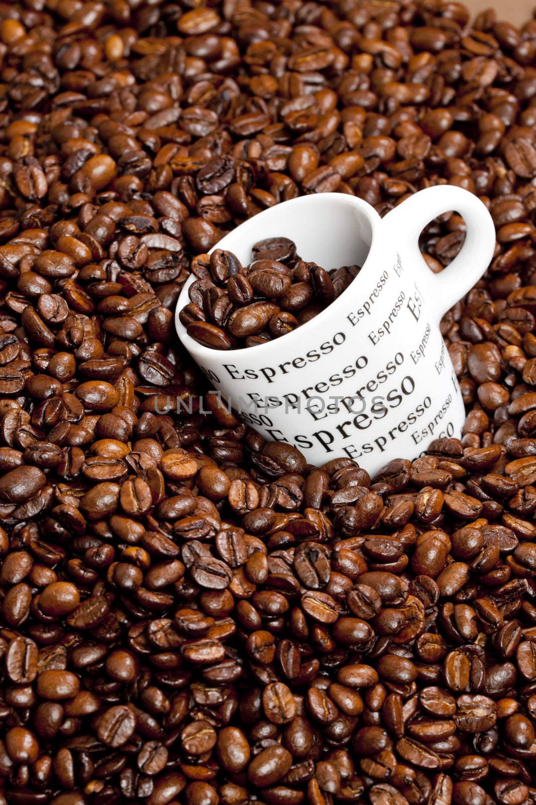 cup of coffee with coffee beans