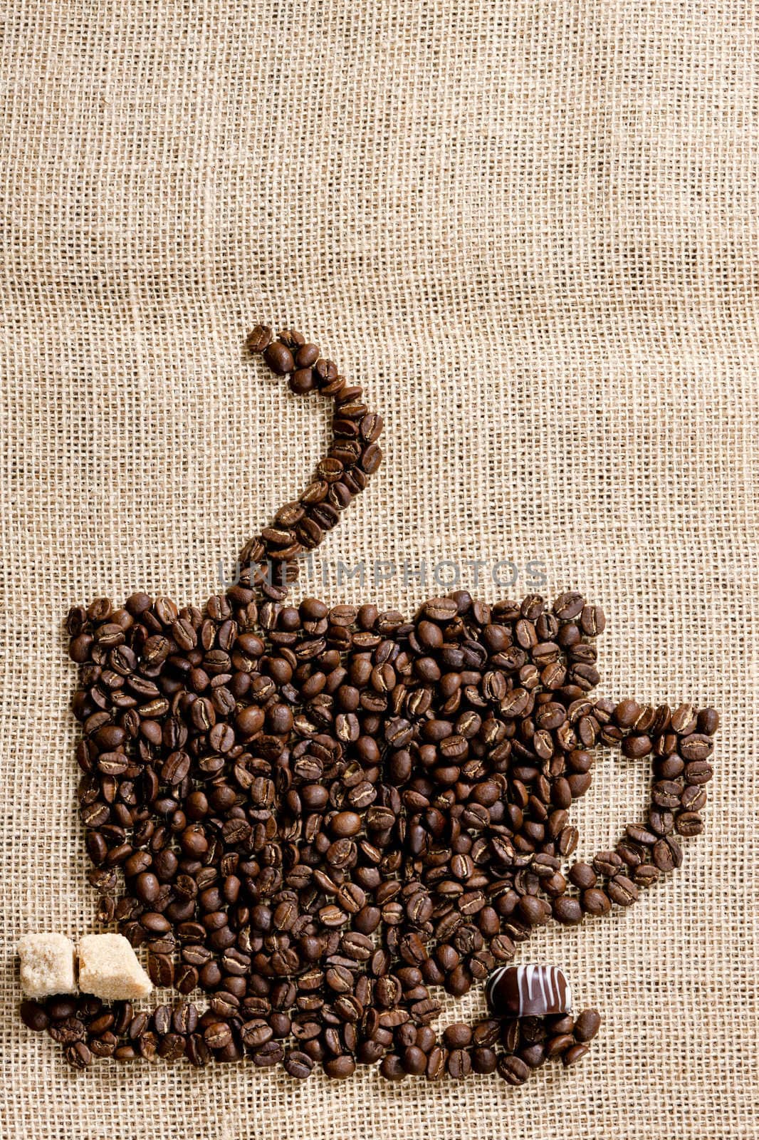 cup of coffee made of coffee beans with sugar and chocolate