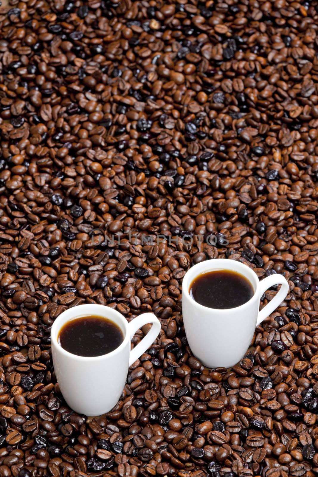 still life of coffee cups and coffee beans
