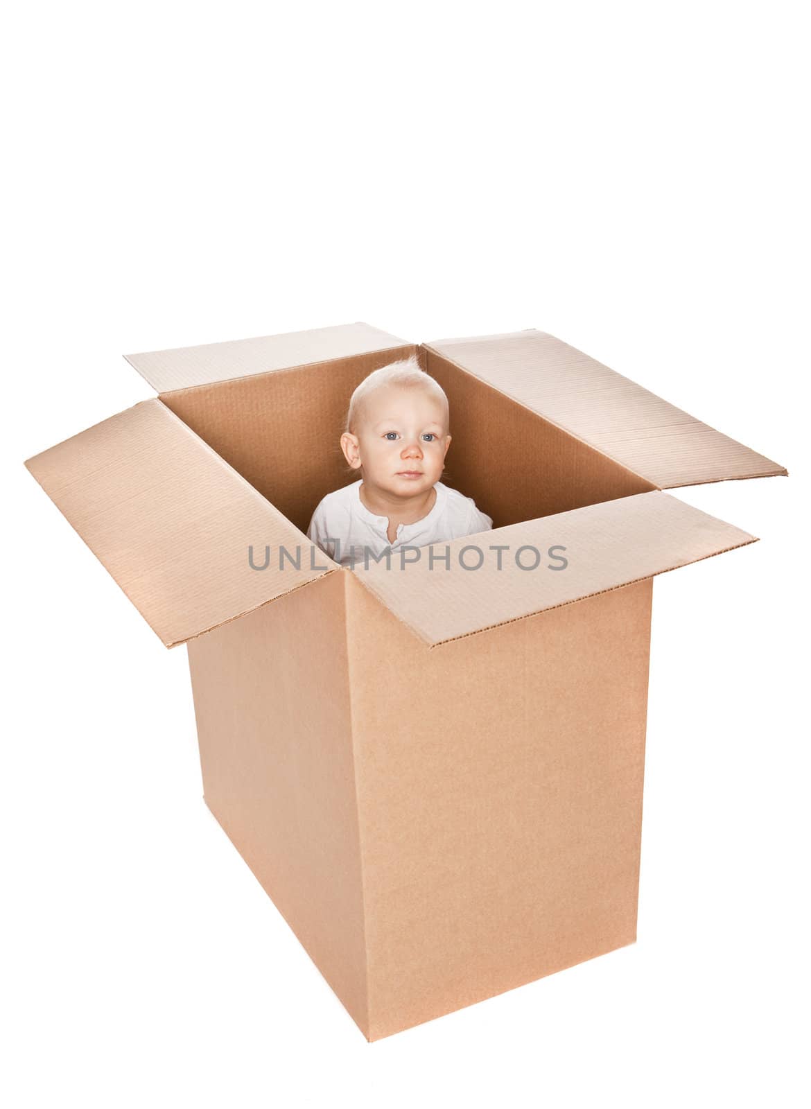 Baby boy in a box isolated against a white background