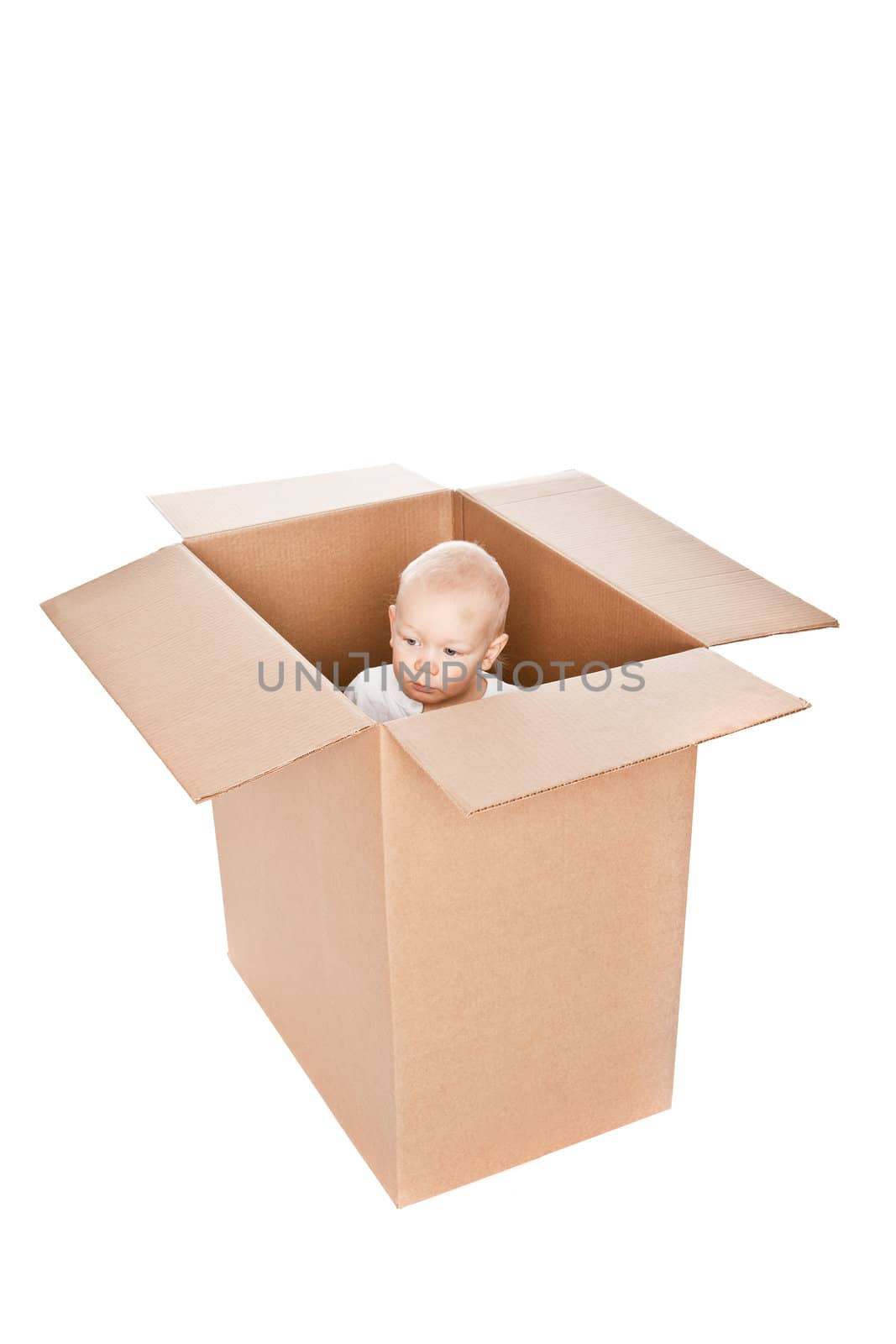 Baby boy in a box isolated against a white background