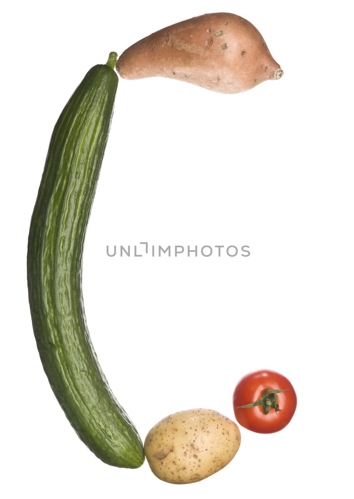 The letter 'C' made out of vegetables isolated on a white background