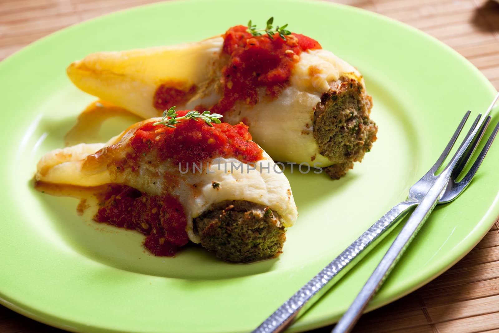 peppers filled with smoked meat and celery tops with tomato sauce