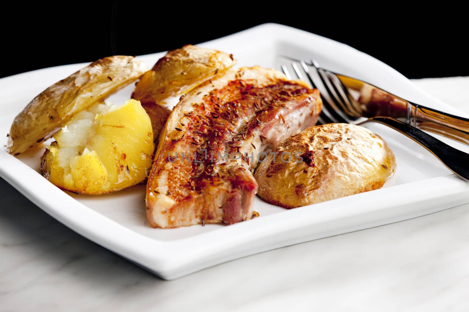 roasted pork meat with potatoes