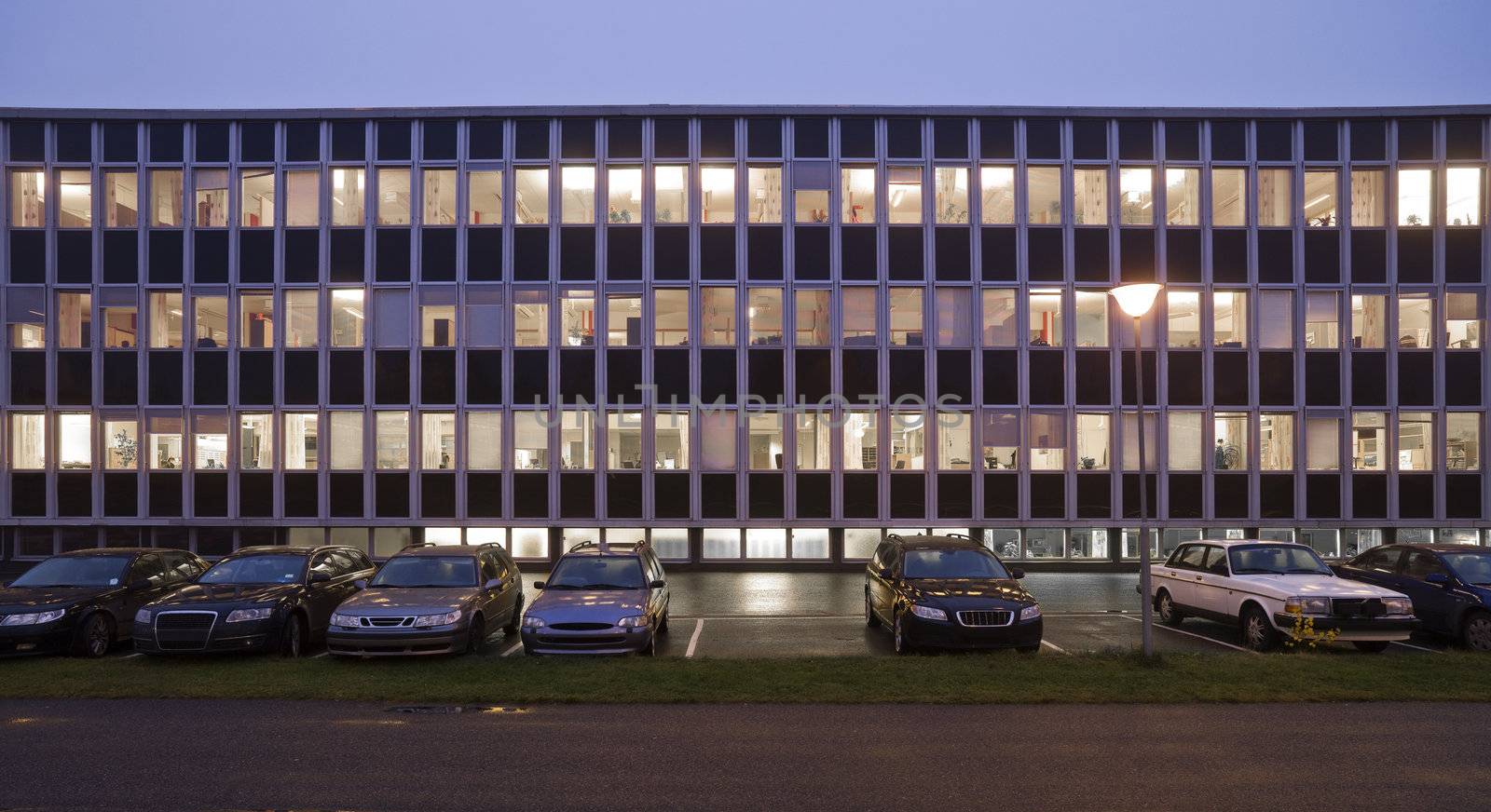 Office building with a dark bly sky in the background