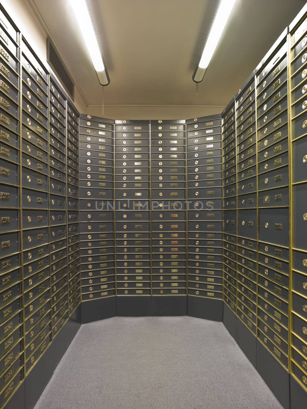 Rows of luxurious safe deposit boxes in a bank vault