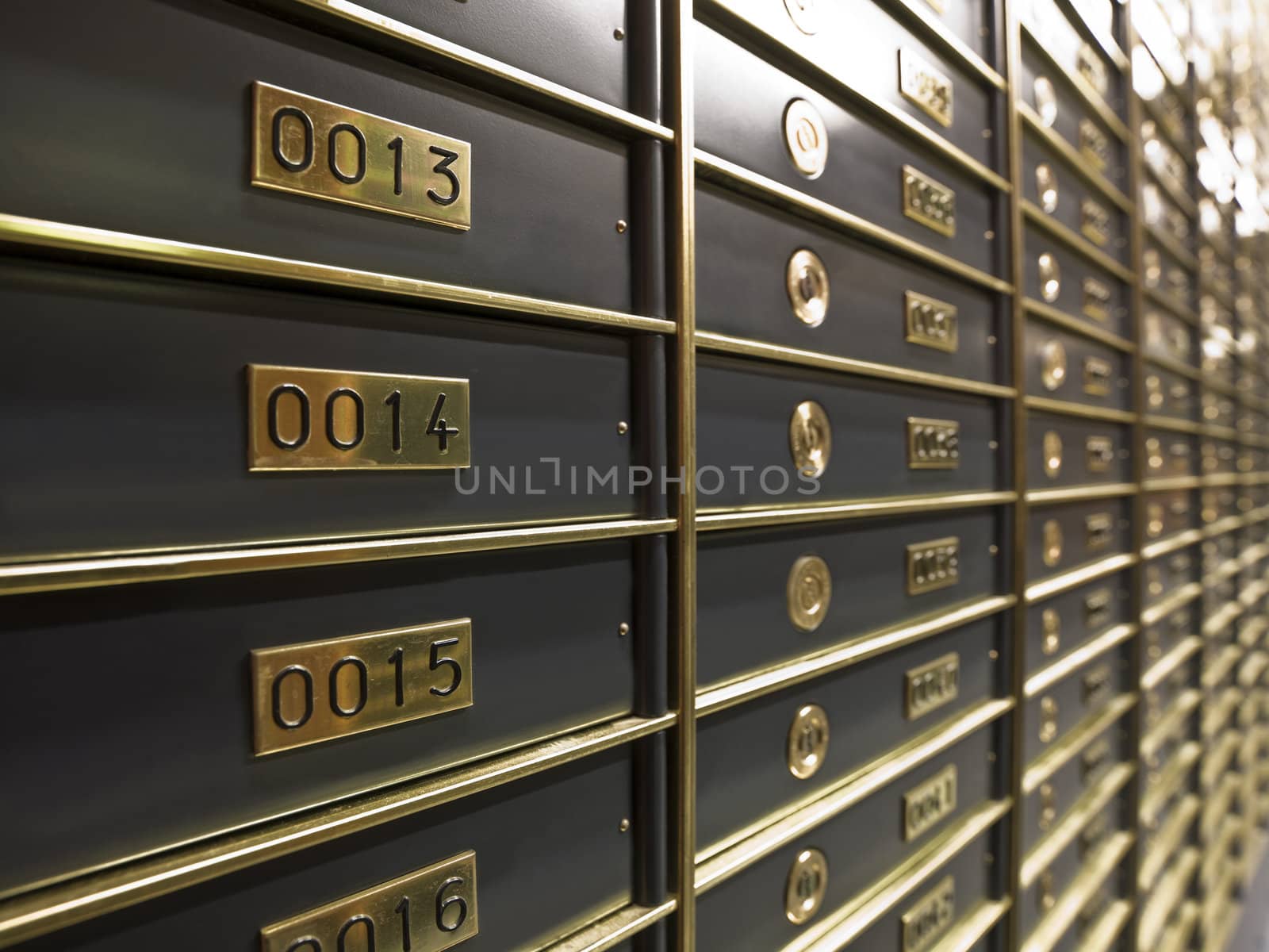 Rows of luxurious safe deposit boxes in a bank vault