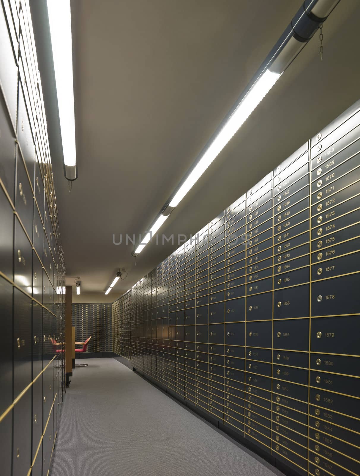 Rows of luxurious safe deposit boxes in a bank vault