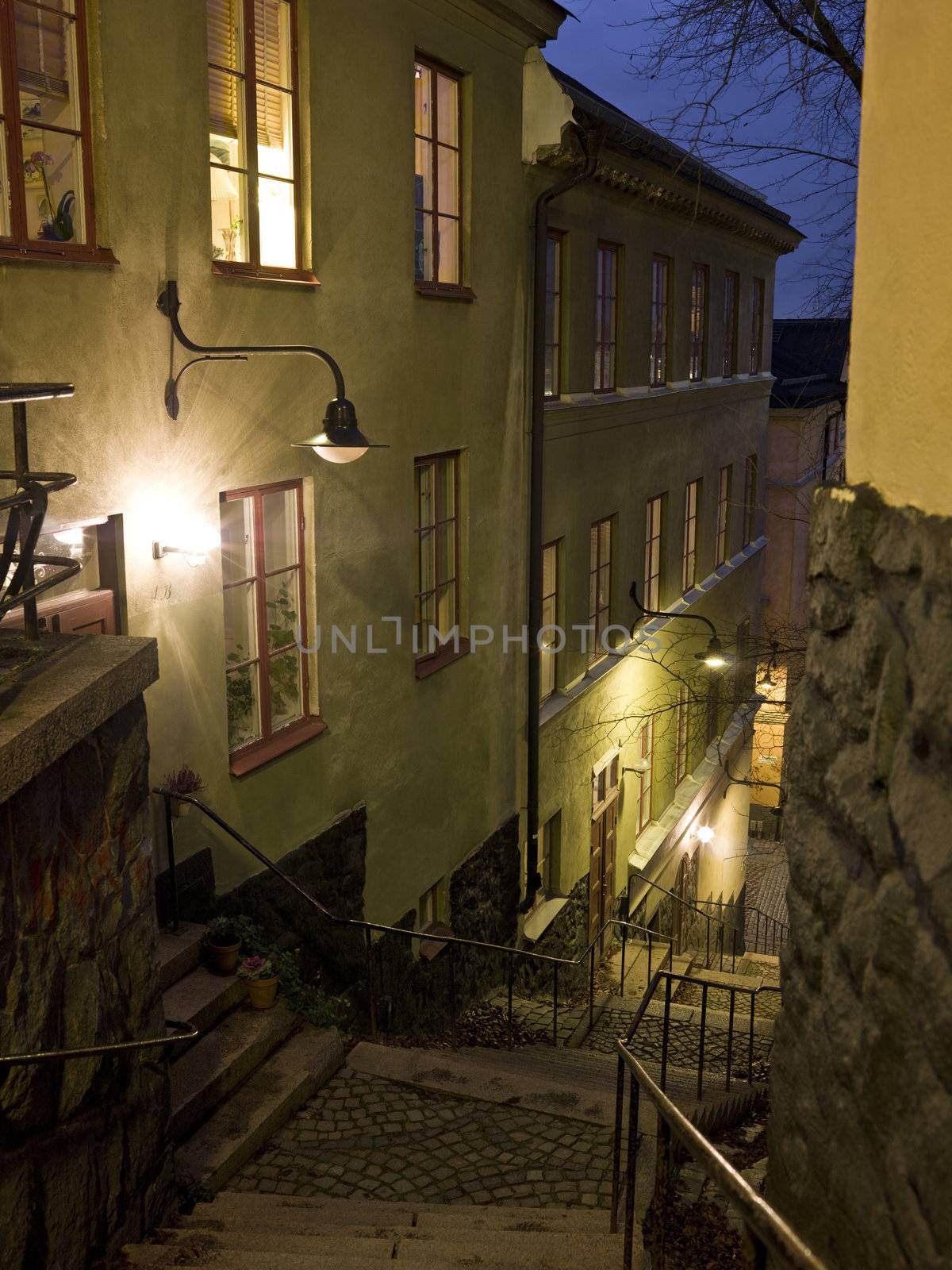 Alley with stairs at night in a city