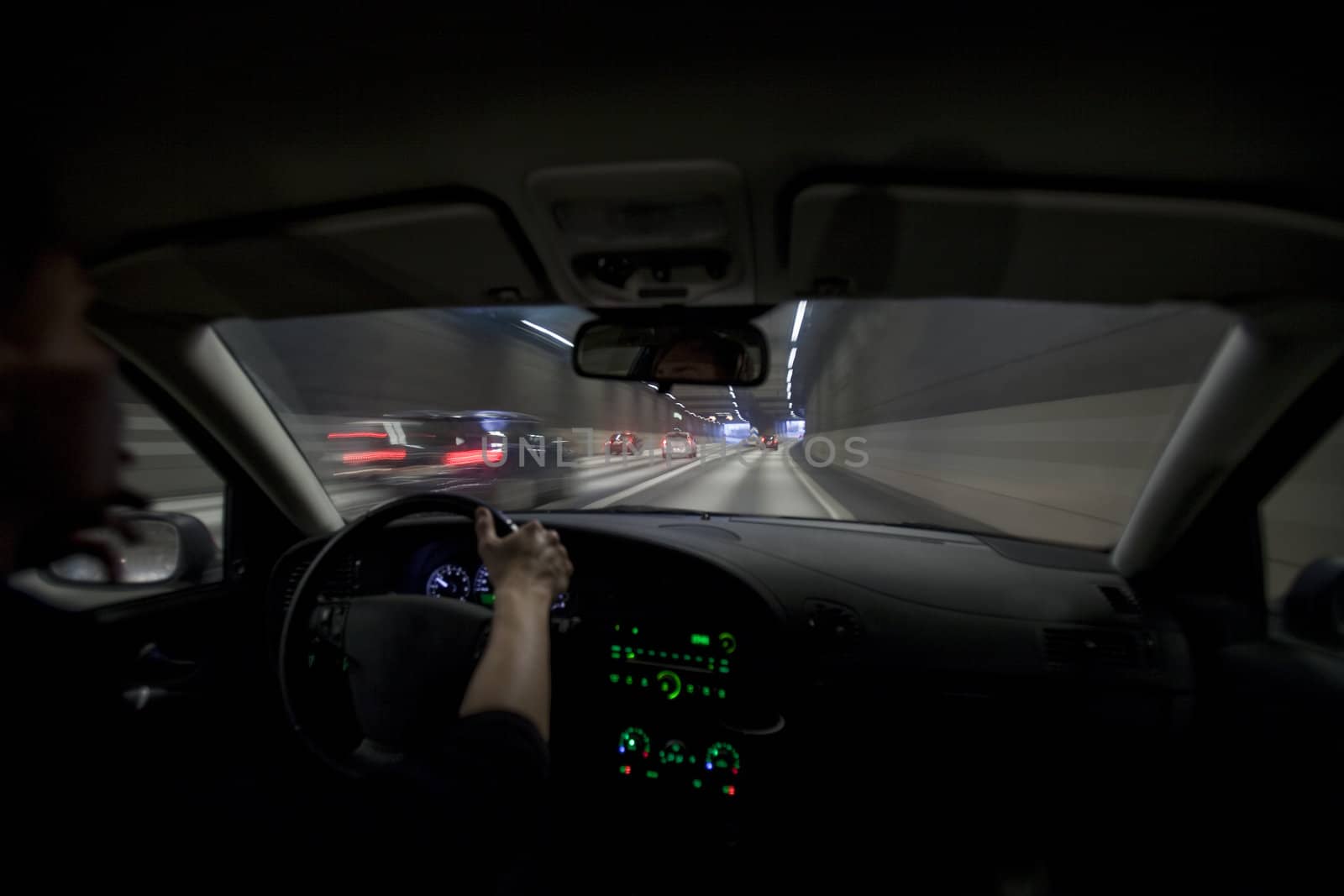 Man driving through a tunnel at night time