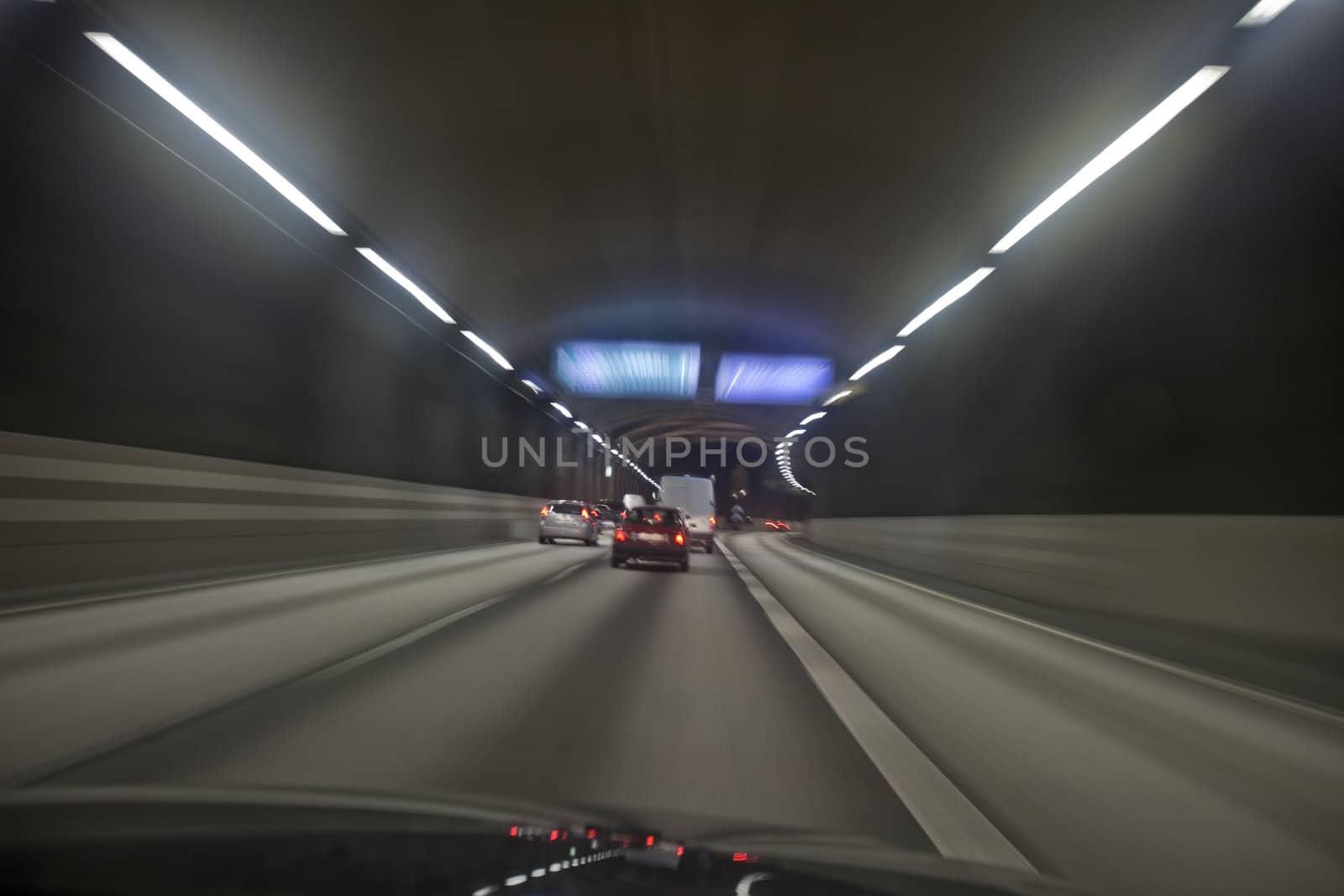 Man driving through a tunnel at night time