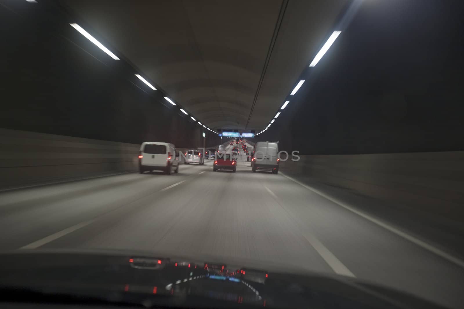 Man driving through a tunnel at night time