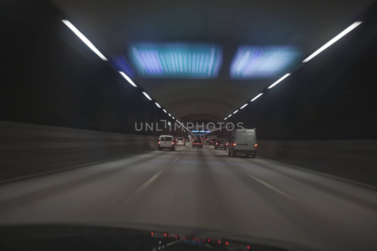 Man driving through a tunnel at night time