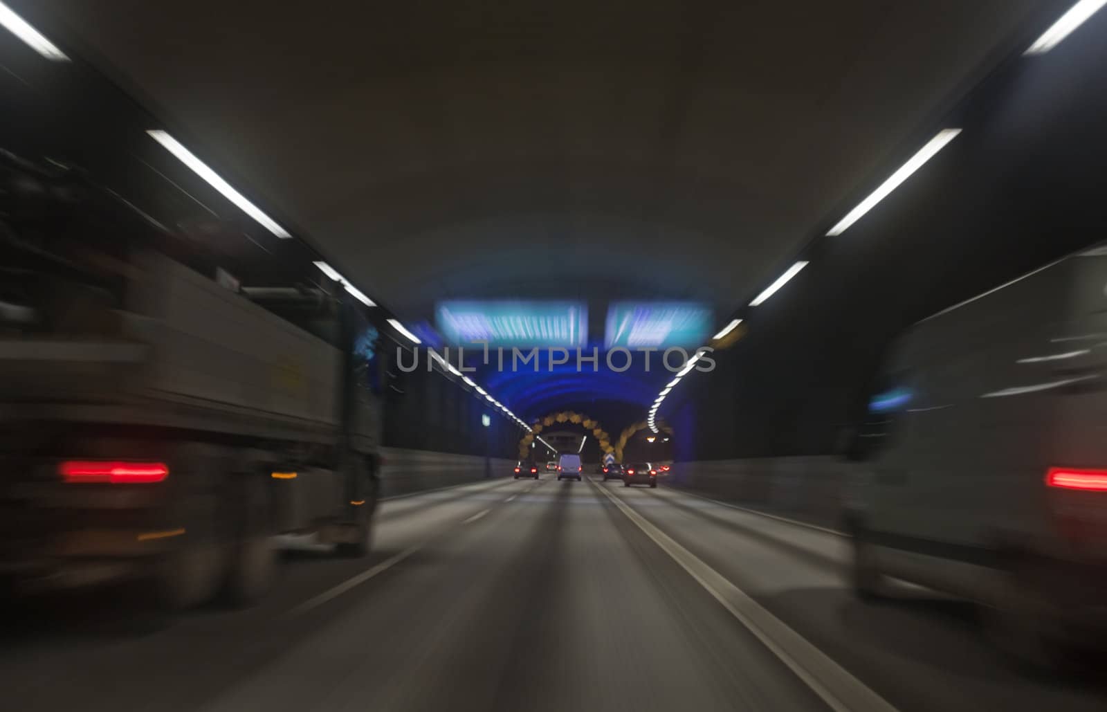 Man driving through a tunnel at night time