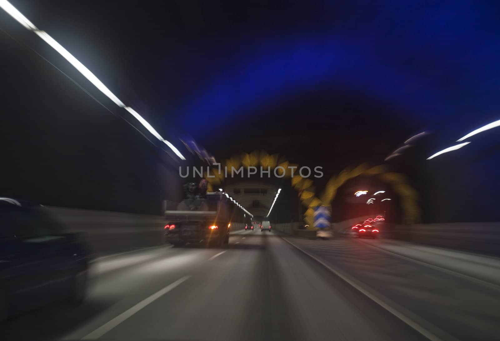 Man driving through a tunnel at night time