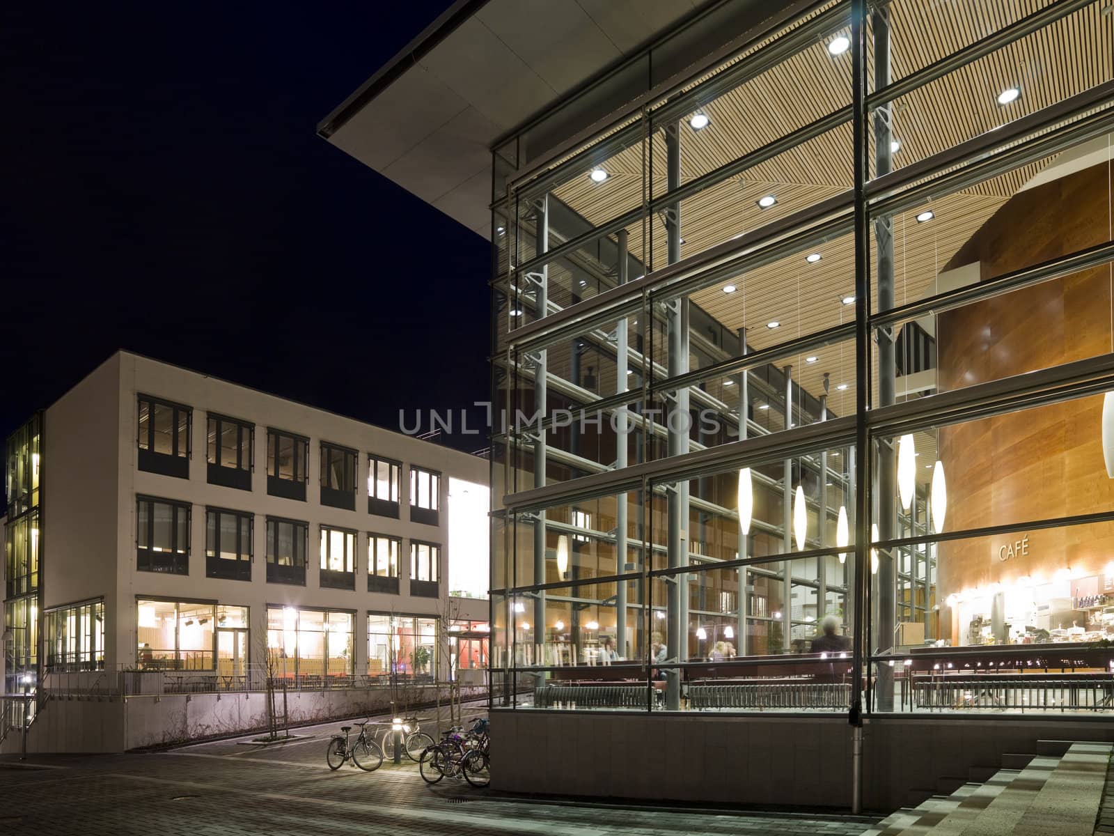 Modern glass building at night time with vivid colors