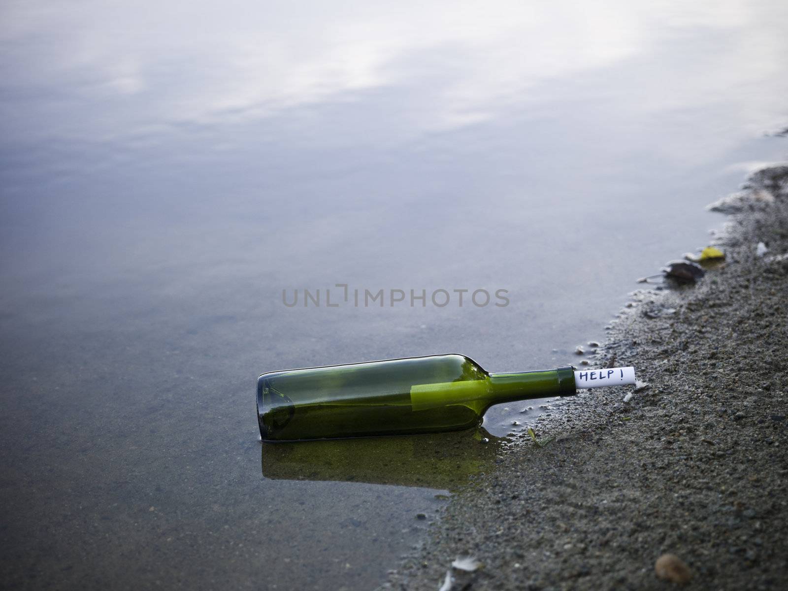 The word 'help' enclosed in a bottle