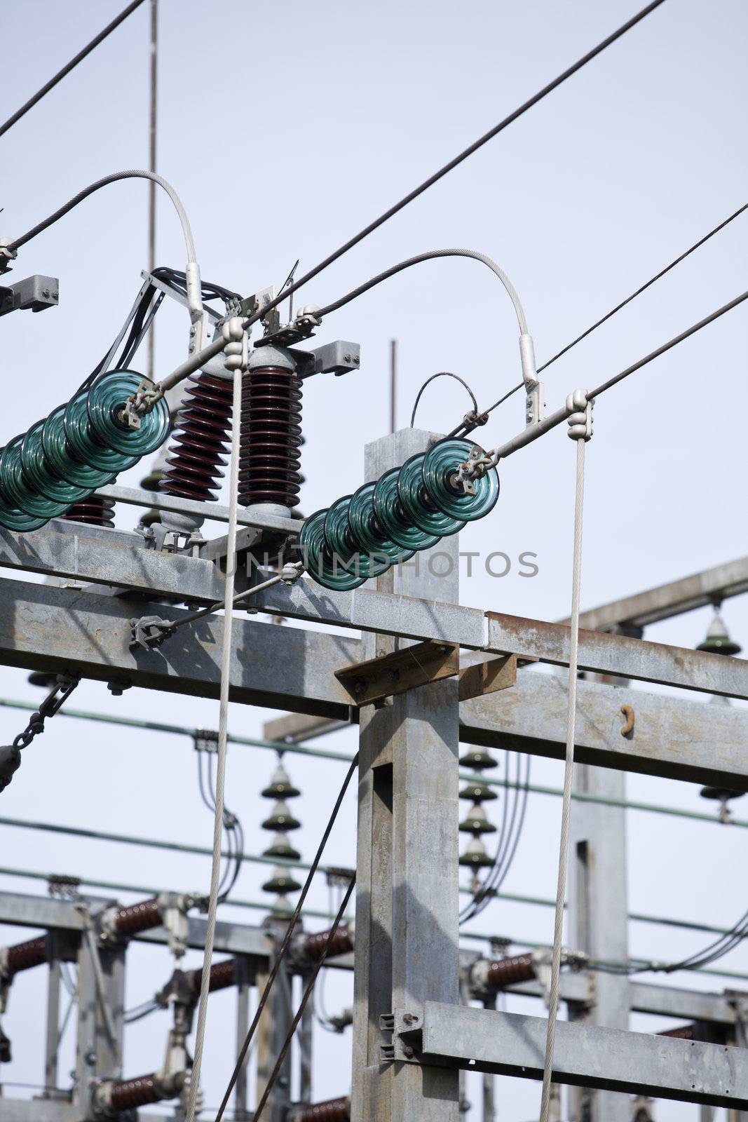 Close up on a power cable with a blue sky background.