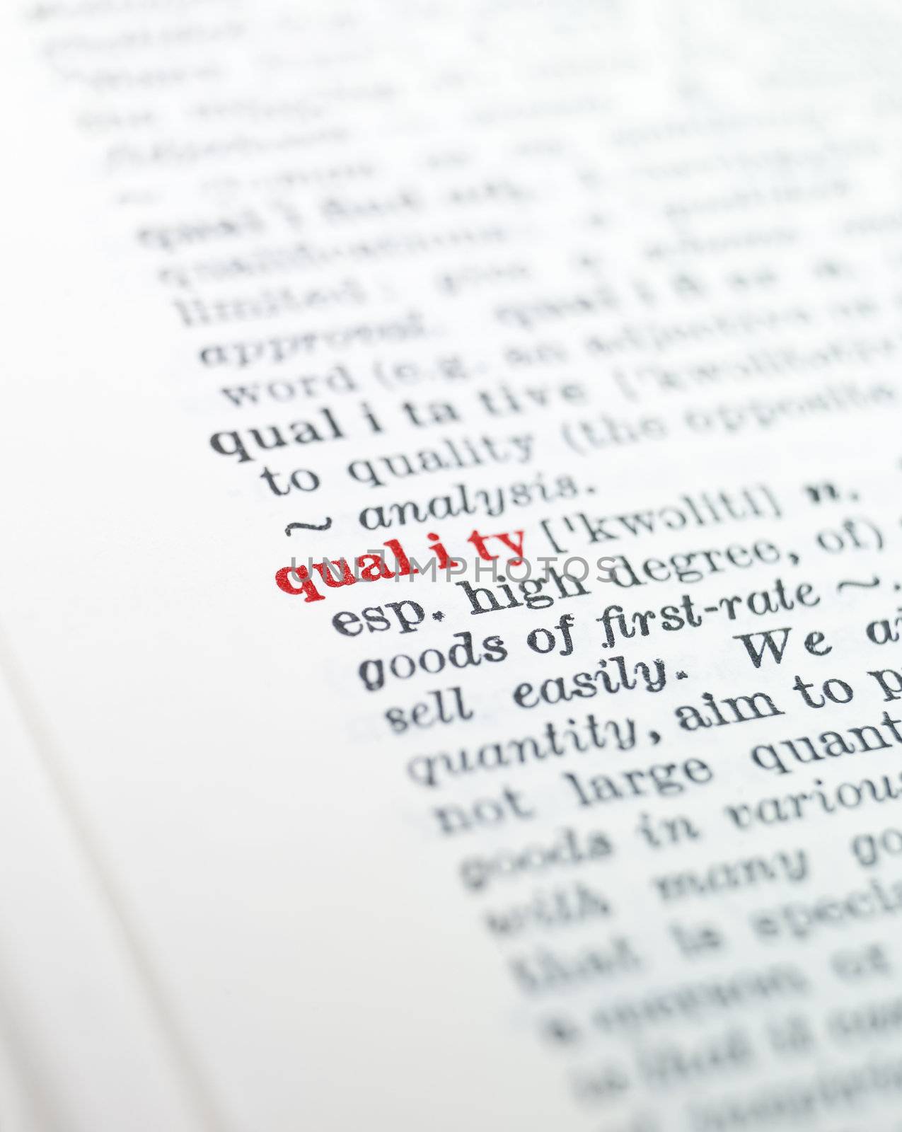 The word 'quality' highlighted in a dictionary
