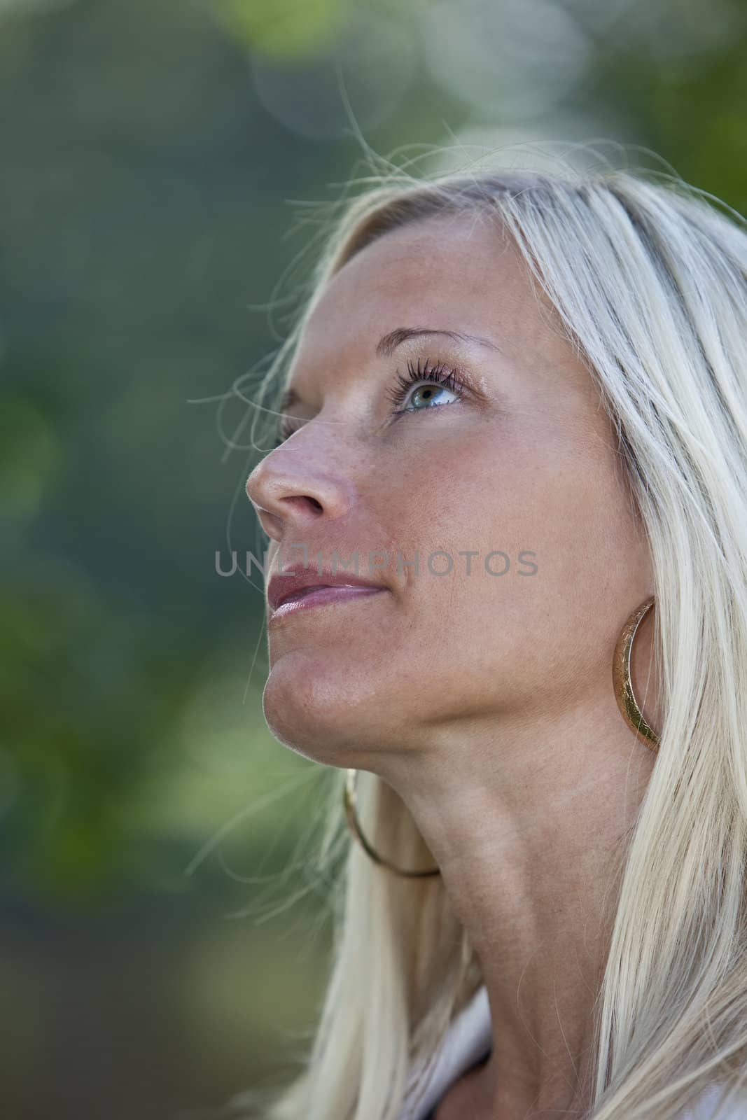 Portrait of a blonde woman smiling.