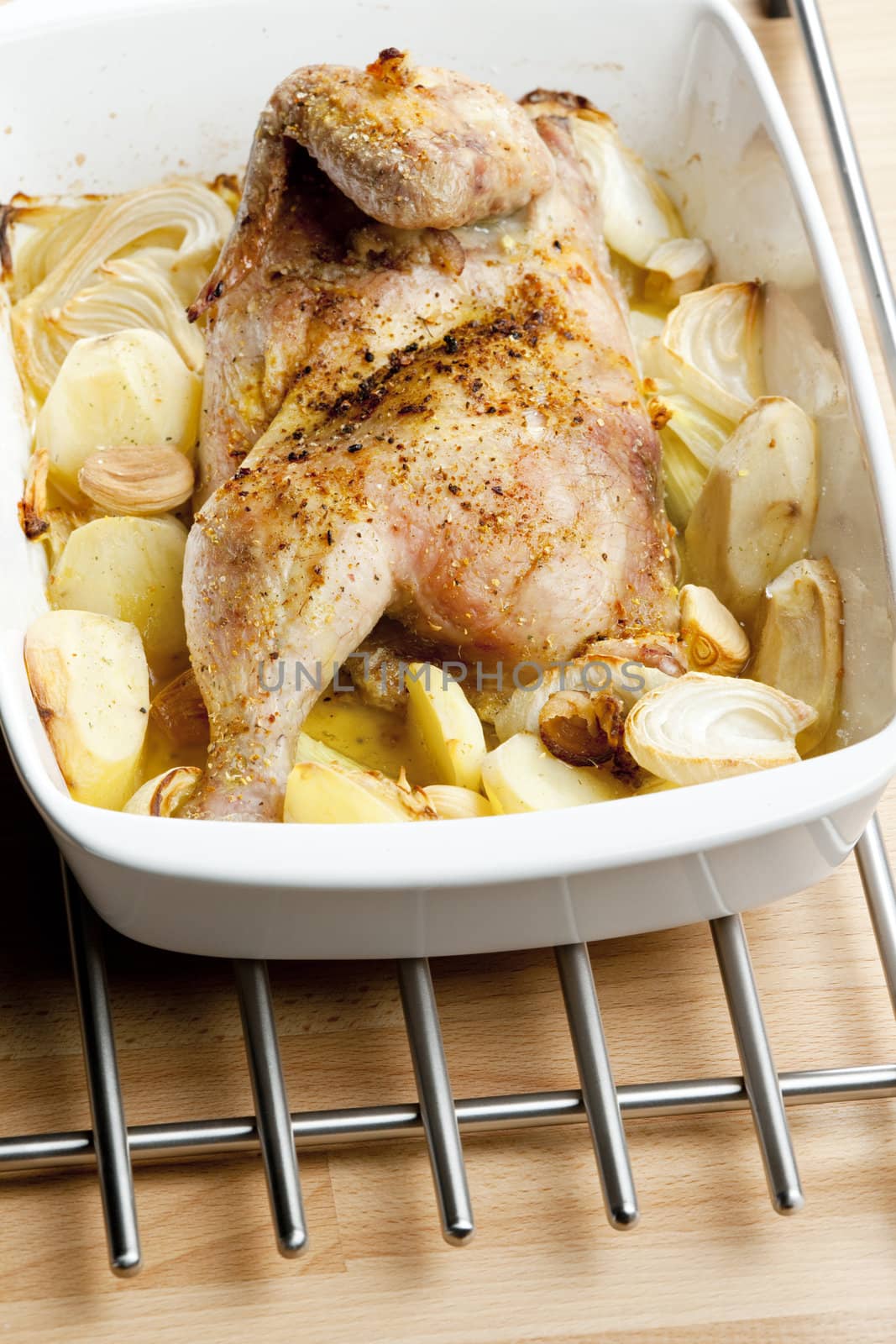chicken baked with onion and potatoes