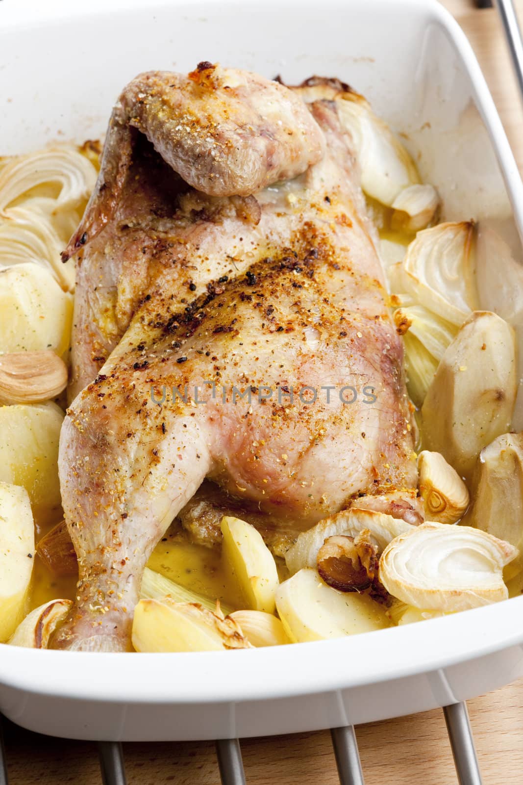 chicken baked with onion and potatoes