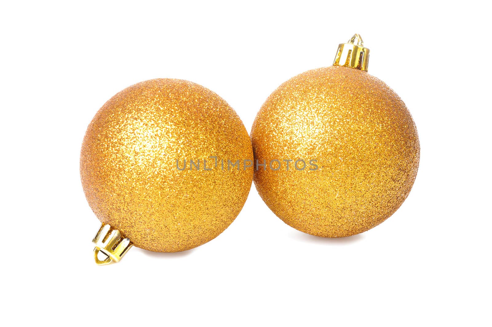 two golden yellow Christmas balls Isolated on white
