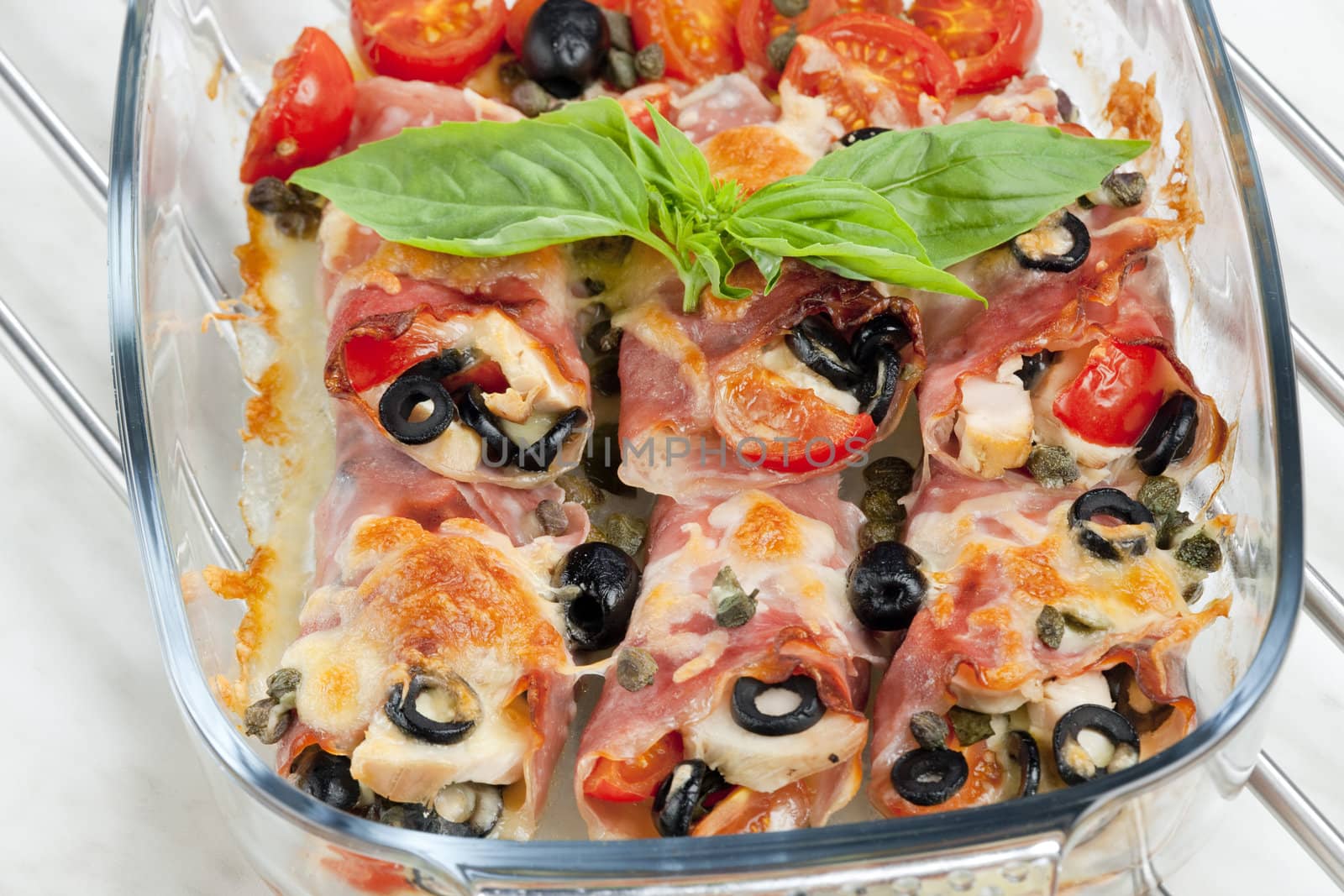 baked ham rolls filled with chicken meat and black olives