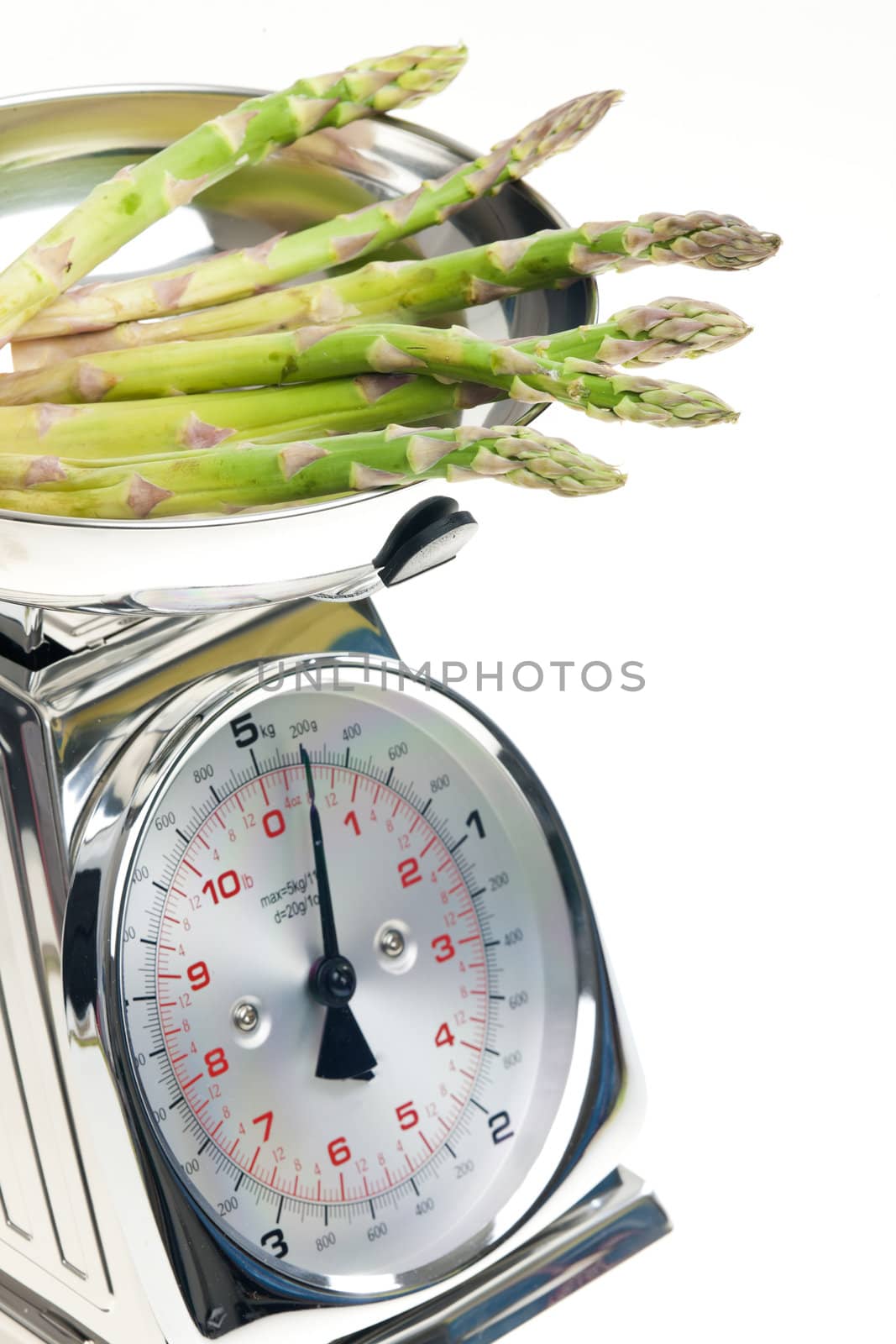 green asparagus on kitchen scales