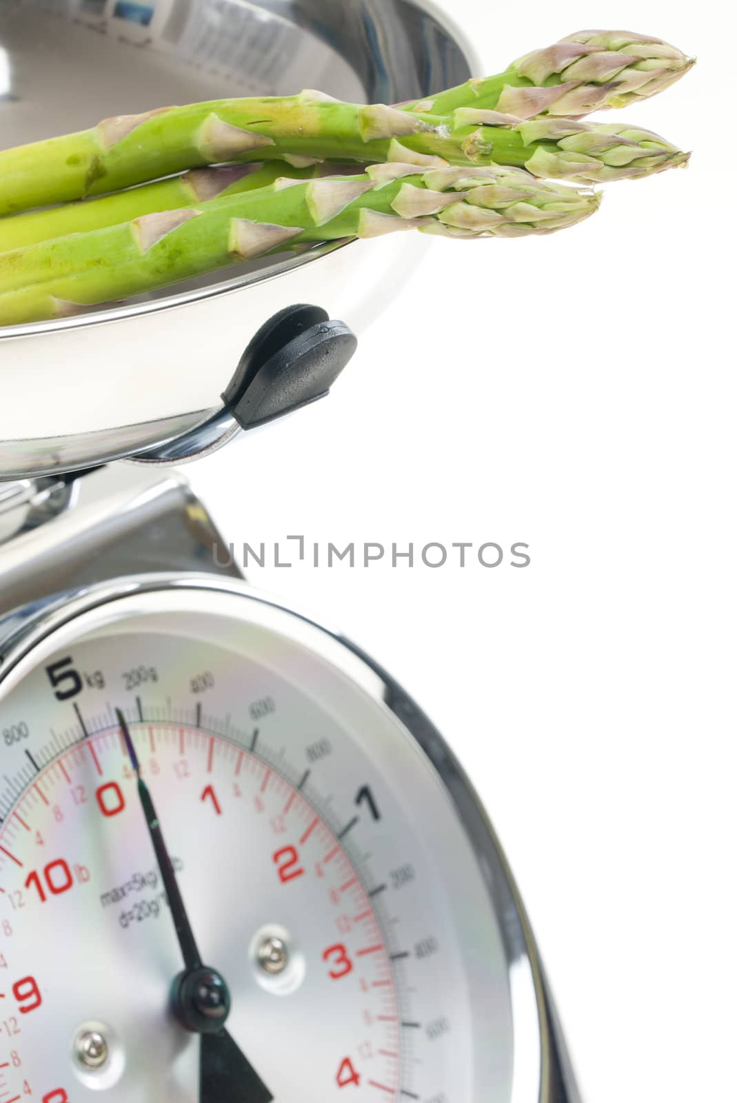 green asparagus on kitchen scales