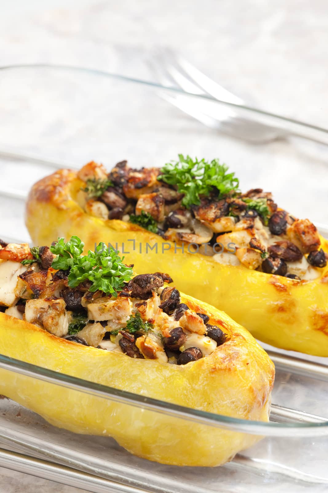 chicken meat with black beans baked in potatoes