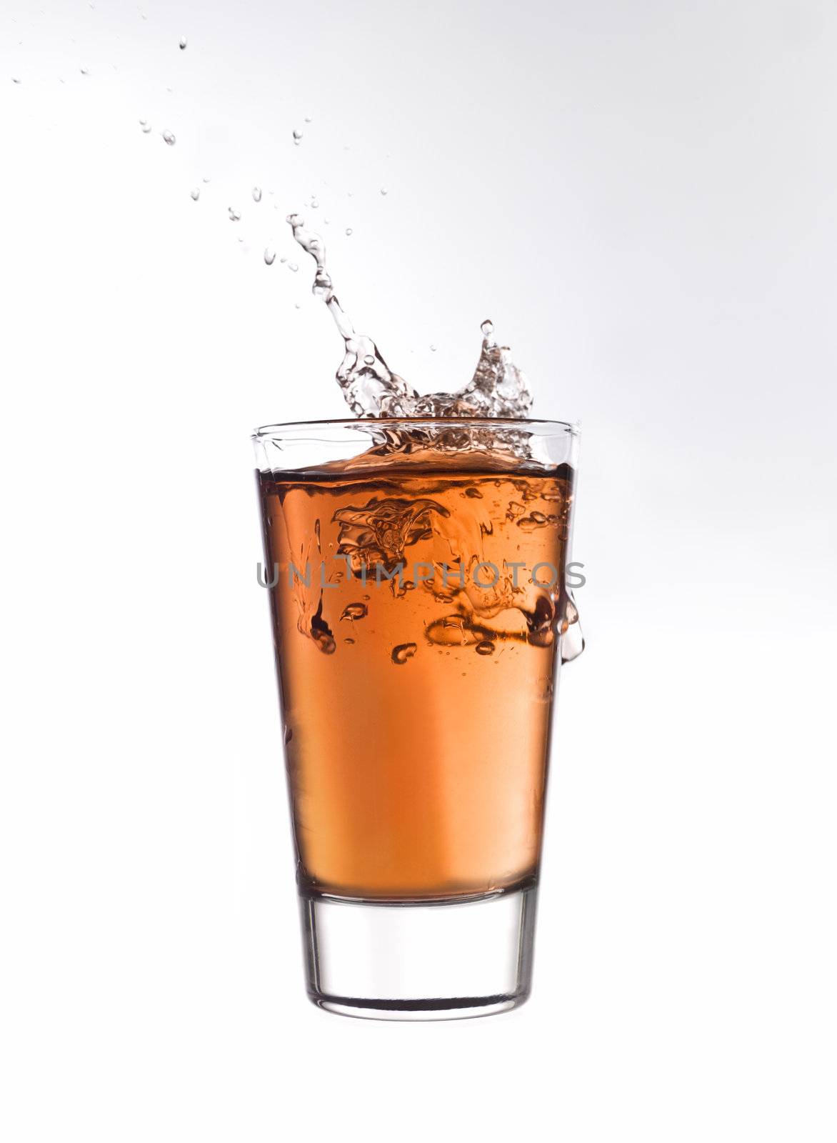 Splash in a glass of red lemonade