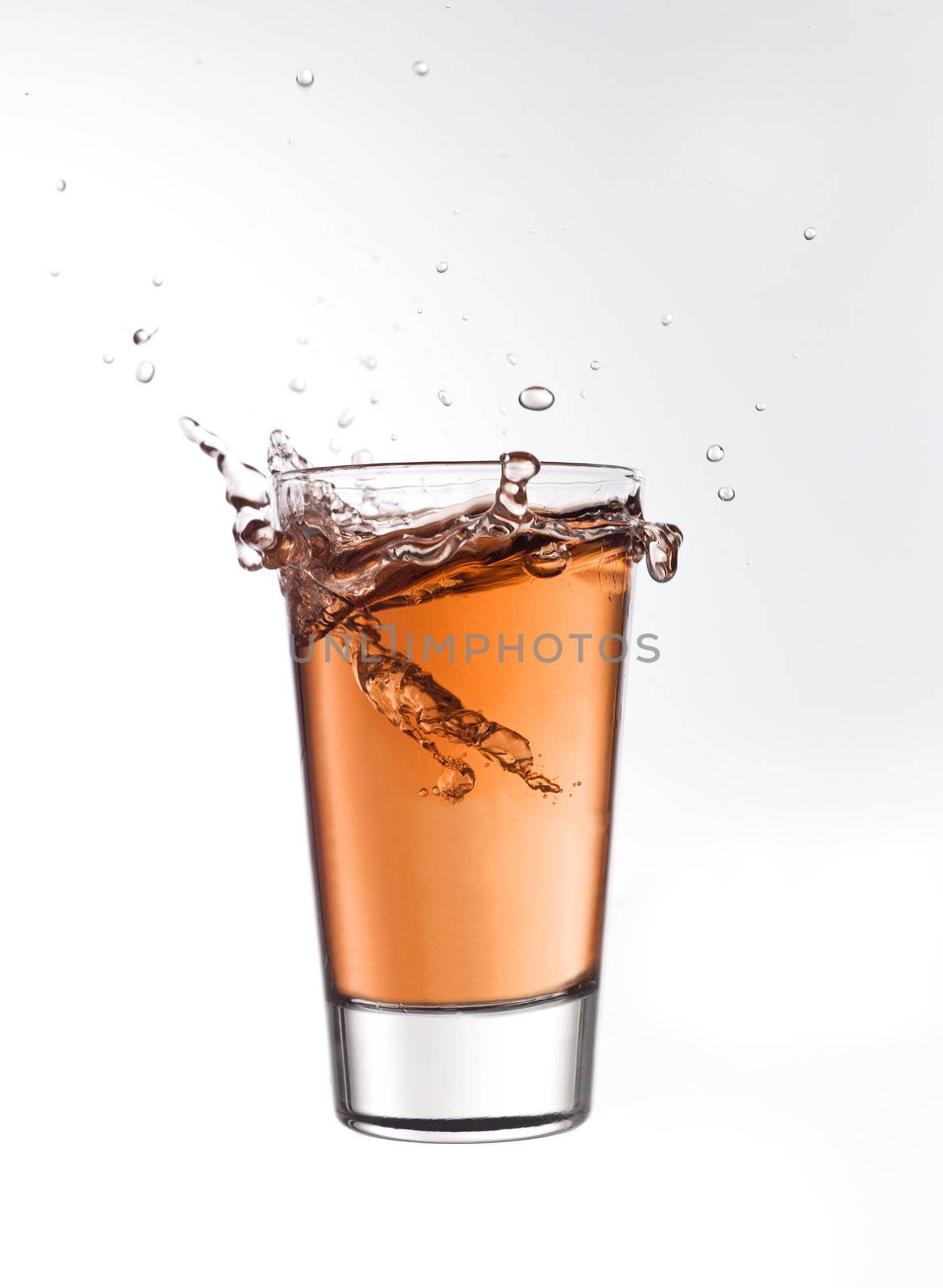 Splash in a glass of red lemonade