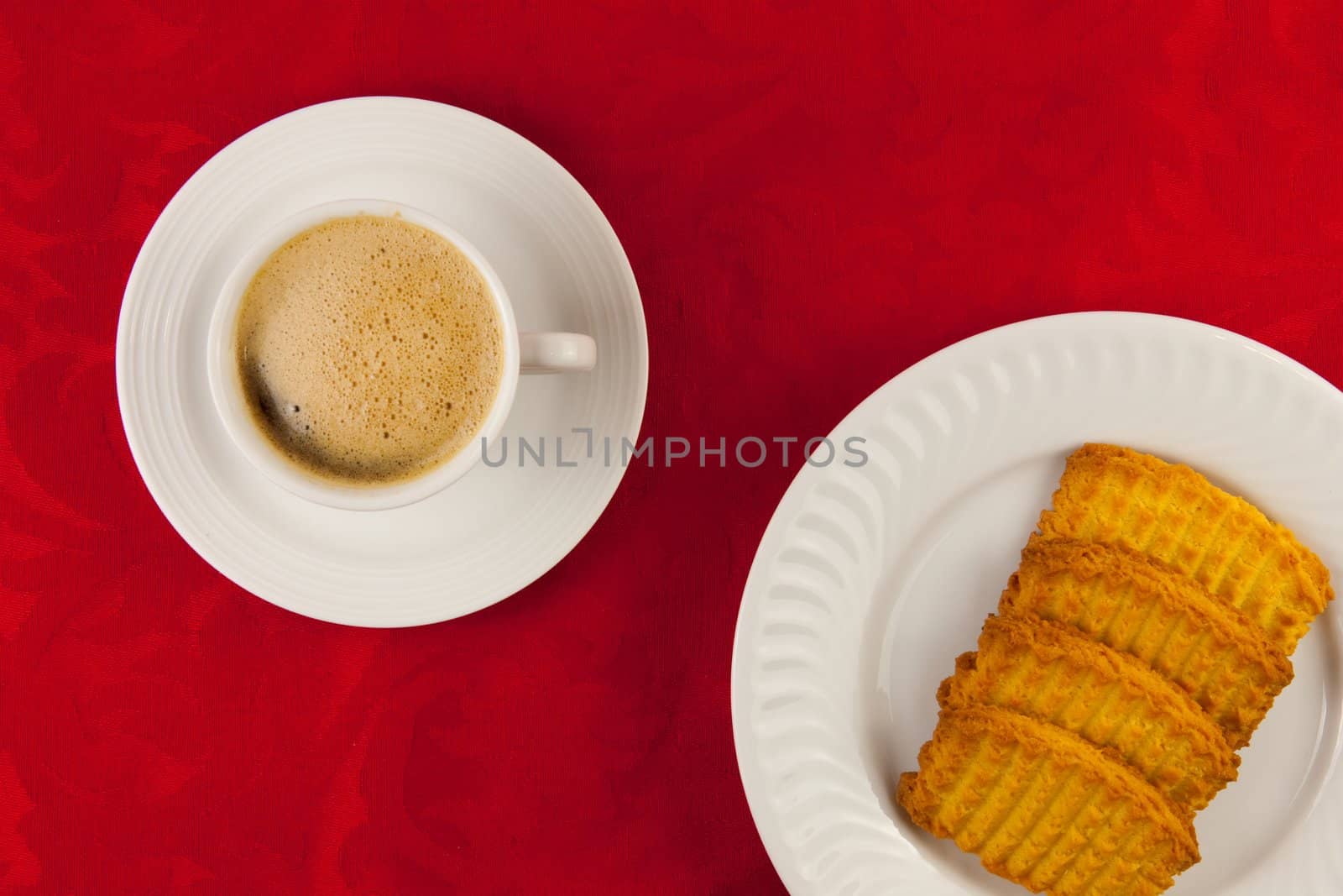 Coffee and cookies on a red background
