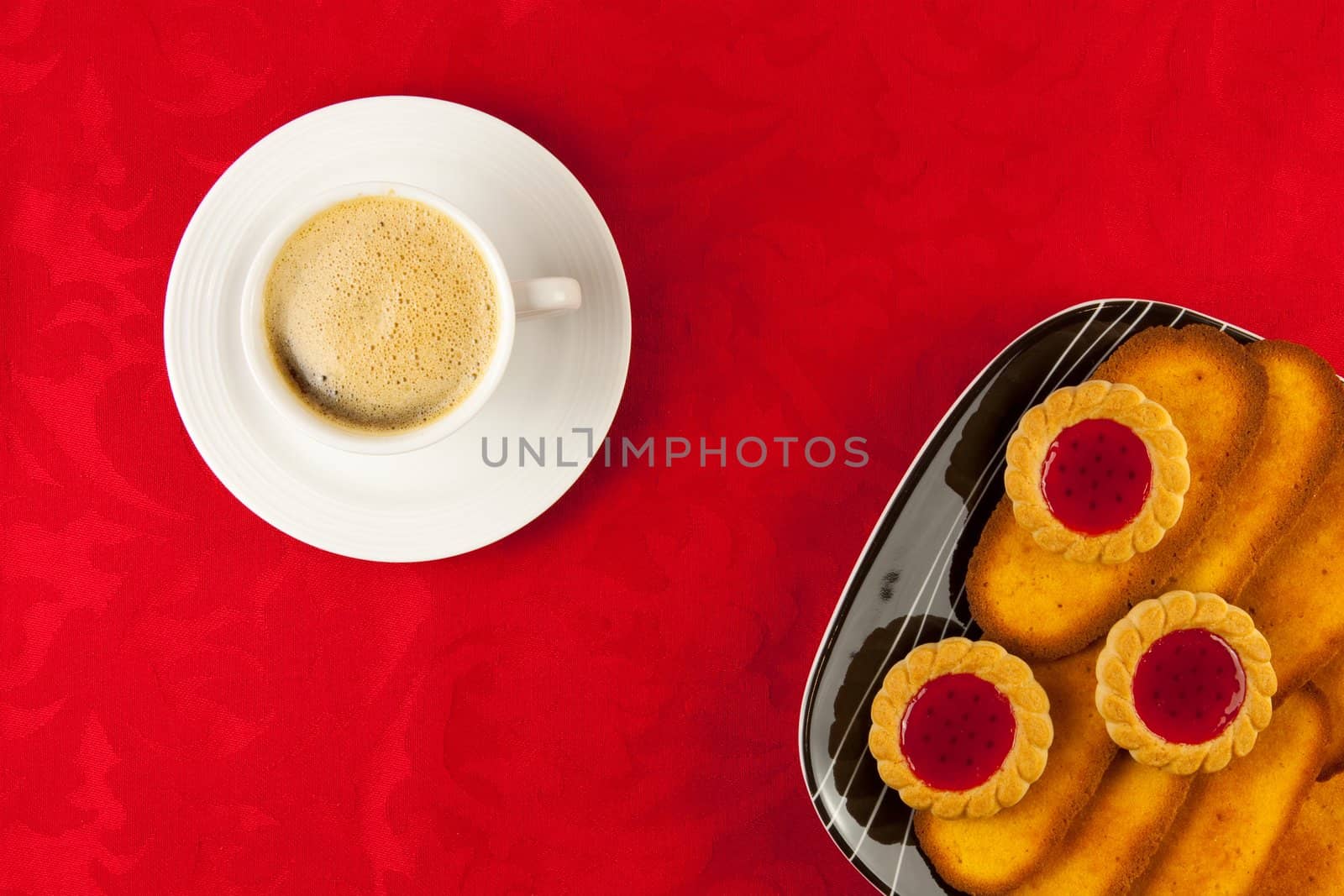 Coffee and cookies on a red background