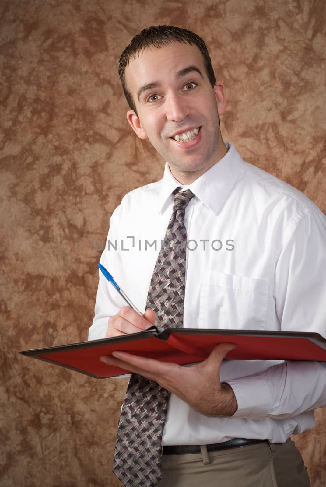 A waiter holding a pen and a binder about to take someone's order